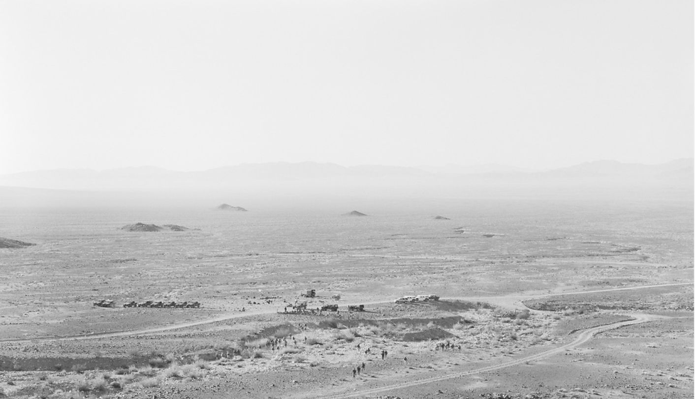 An-My Lê Infantry Platoon Attack, from 29 Palms, 2003-2004 Silver gelatin print 26 1/2 x 38 in. (67.3 x 96.5...