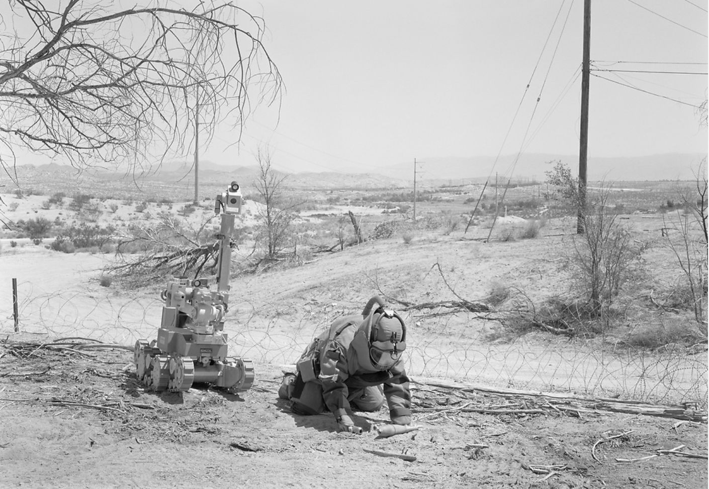 An-My Lê Explosive Ordinance Disposal, from 29 Palms, 2003-2004 Silver gelatin print 26 1/2 x 38 in. (67.3 x 96.5...