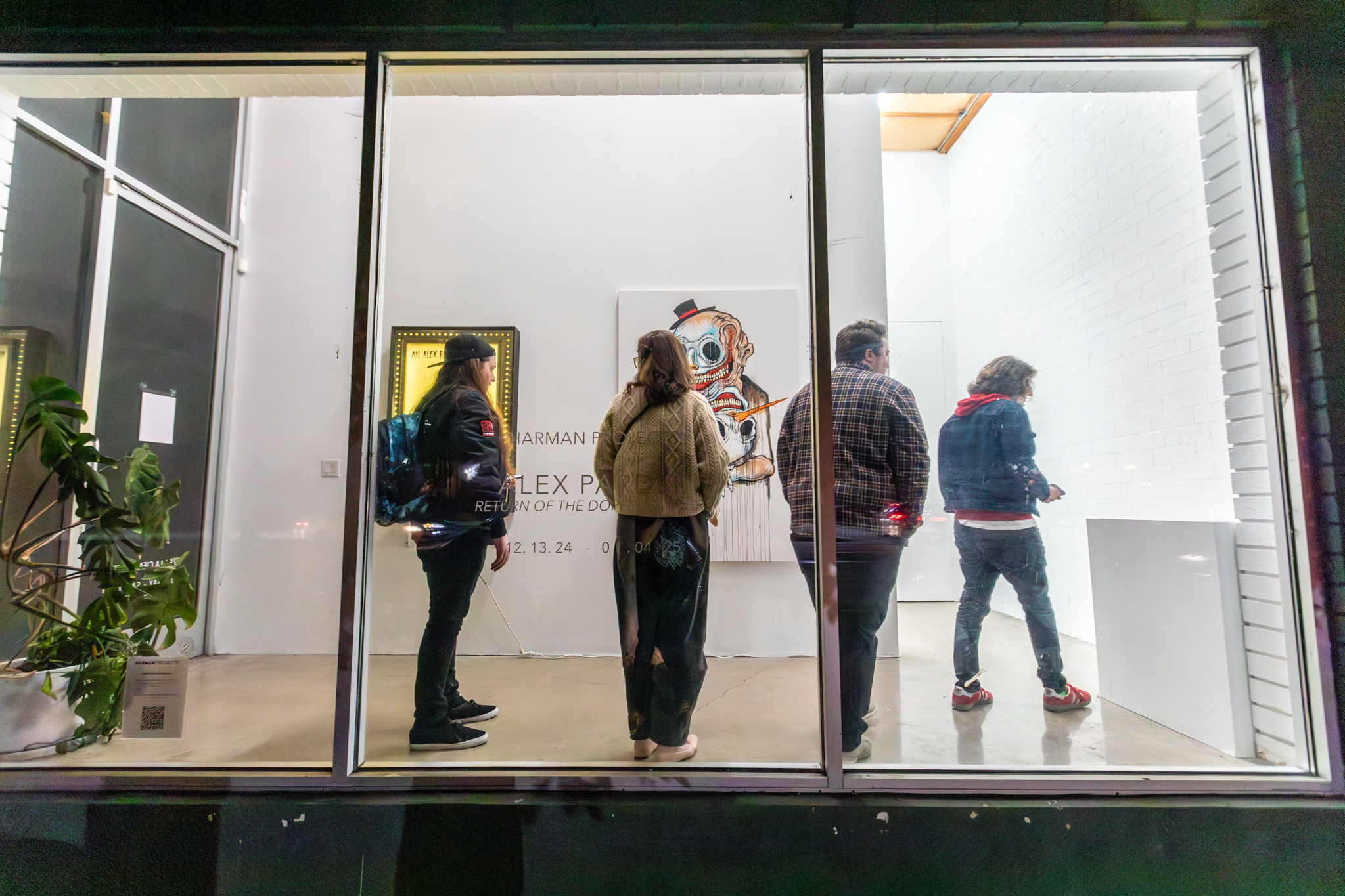 A group of people at the opening reception of Alex Pardee's exhibition at Harman Projects Los Angeles