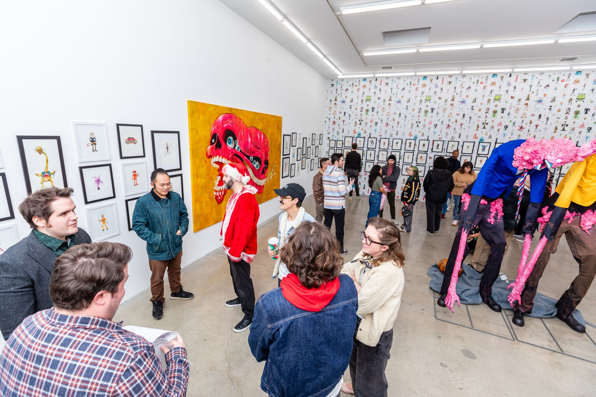 A group of people at the opening reception of Alex Pardee's exhibition at Harman Projects Los Angeles