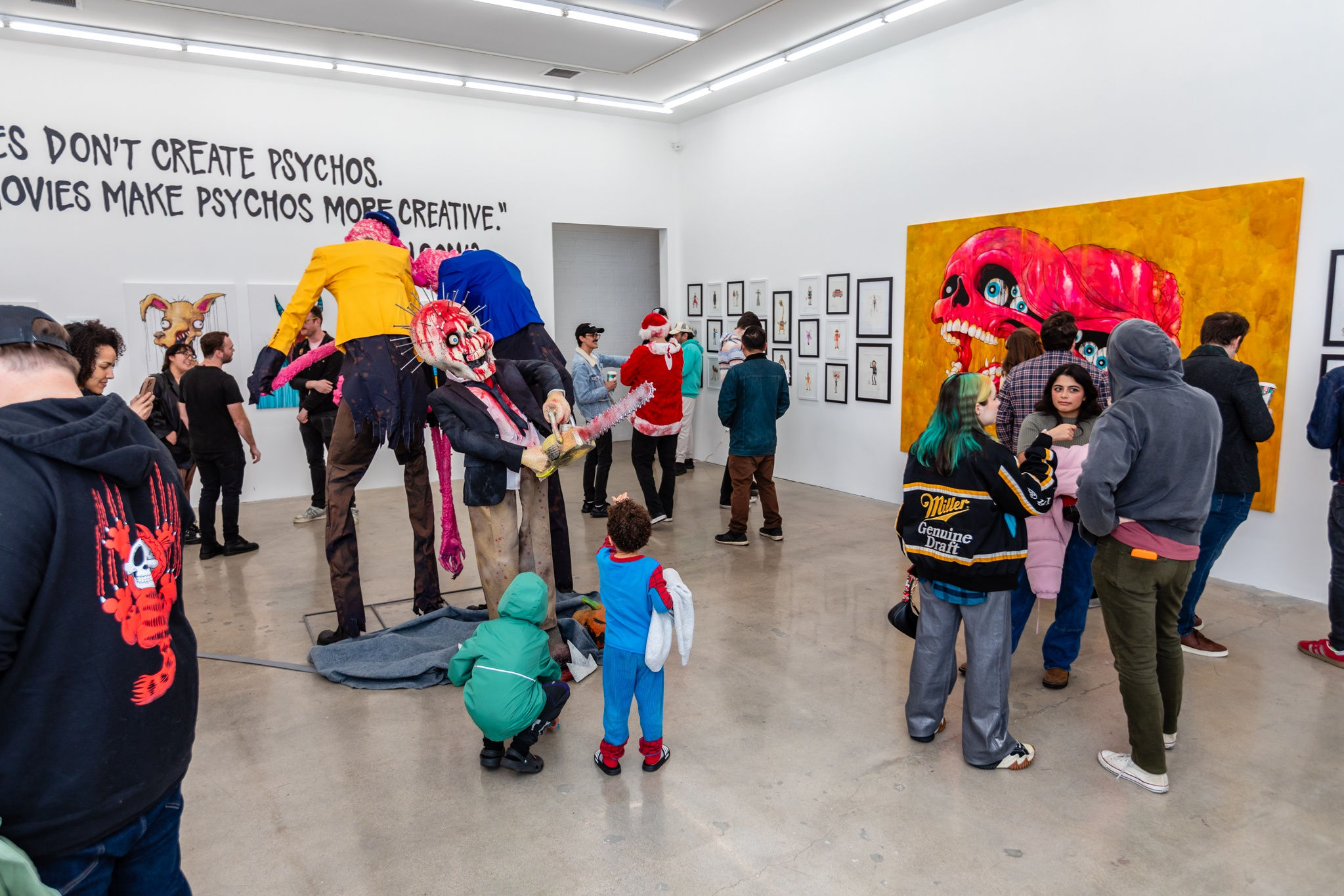 A group of people at the opening reception of Alex Pardee's exhibition at Harman Projects Los Angeles