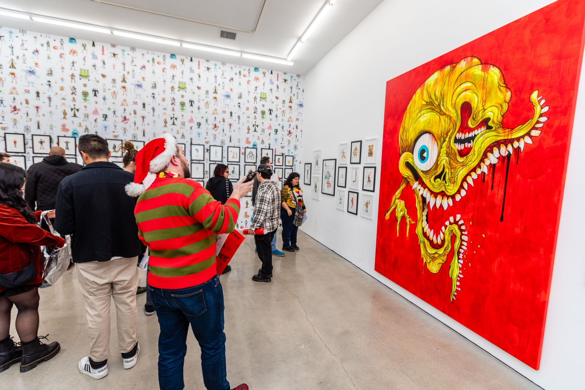 A group of people at the opening reception of Alex Pardee's exhibition at Harman Projects Los Angeles