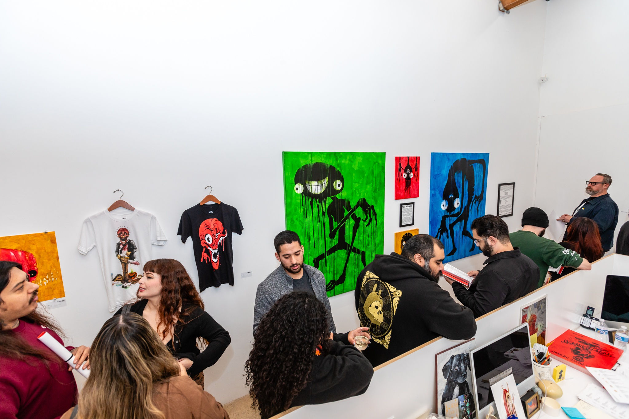 A group of people at the opening reception of Alex Pardee's exhibition at Harman Projects Los Angeles