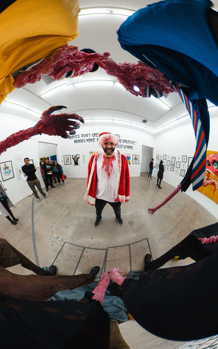 A group of people at the opening reception of Alex Pardee's exhibition at Harman Projects Los Angeles