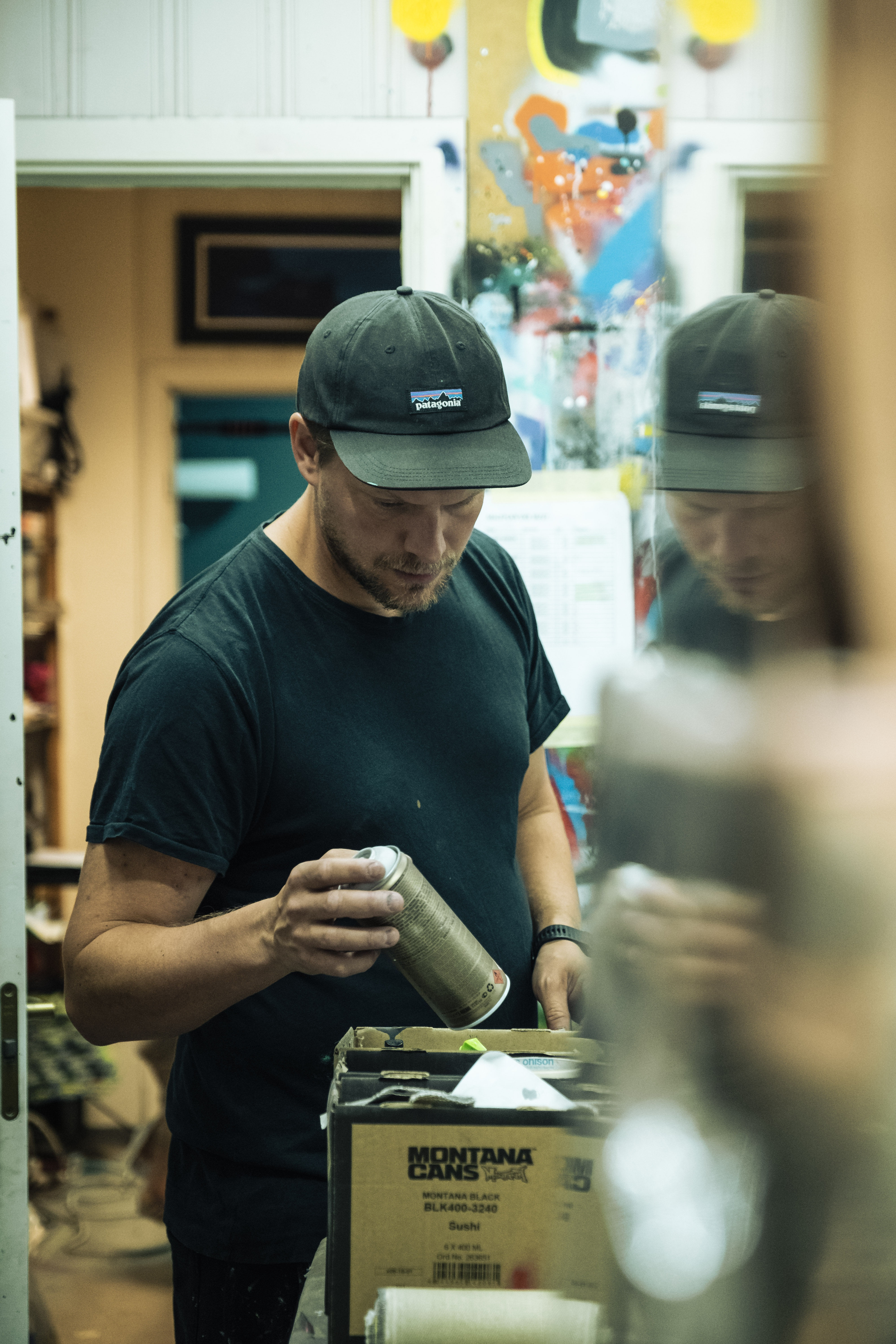 portrait of the artist Martin Whatson inside his studio.