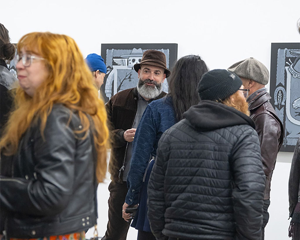 image of a group of visitors at the opening reception for artist Jeremy Fish's exhibition 