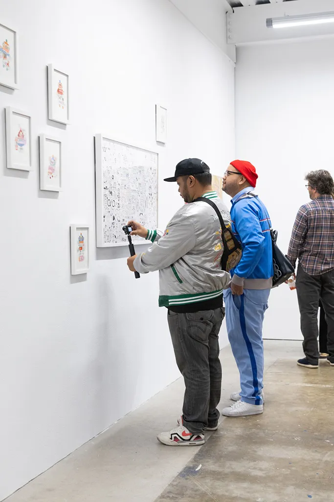 Photo from the opening reception of artist duo KeFe's opening reception for their show Music Island.