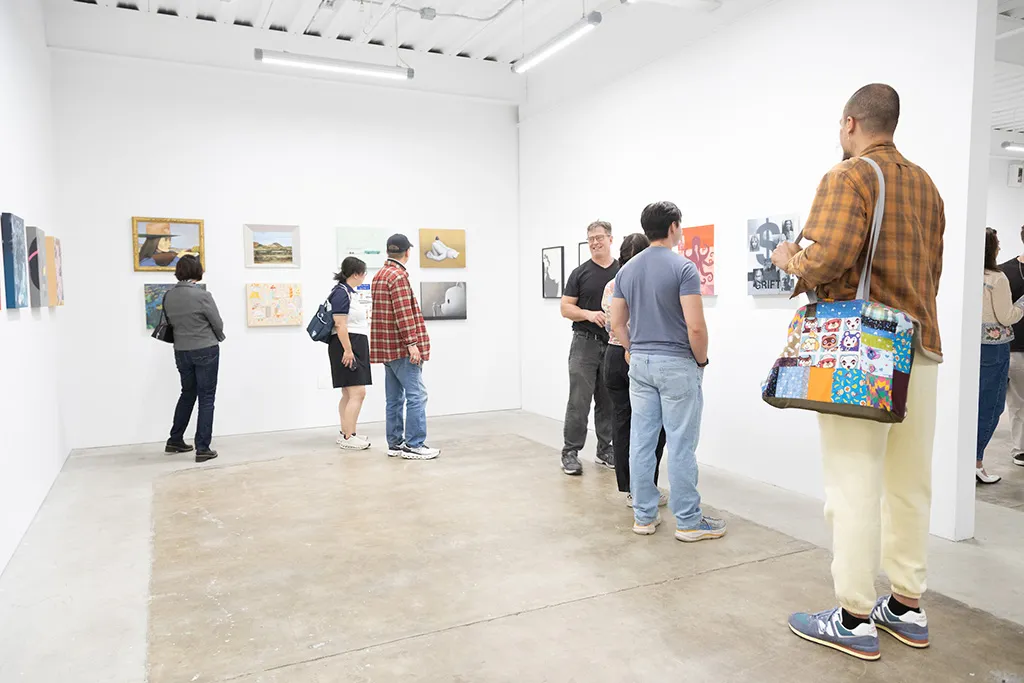 A photo from the opening night reception of the group exhibition