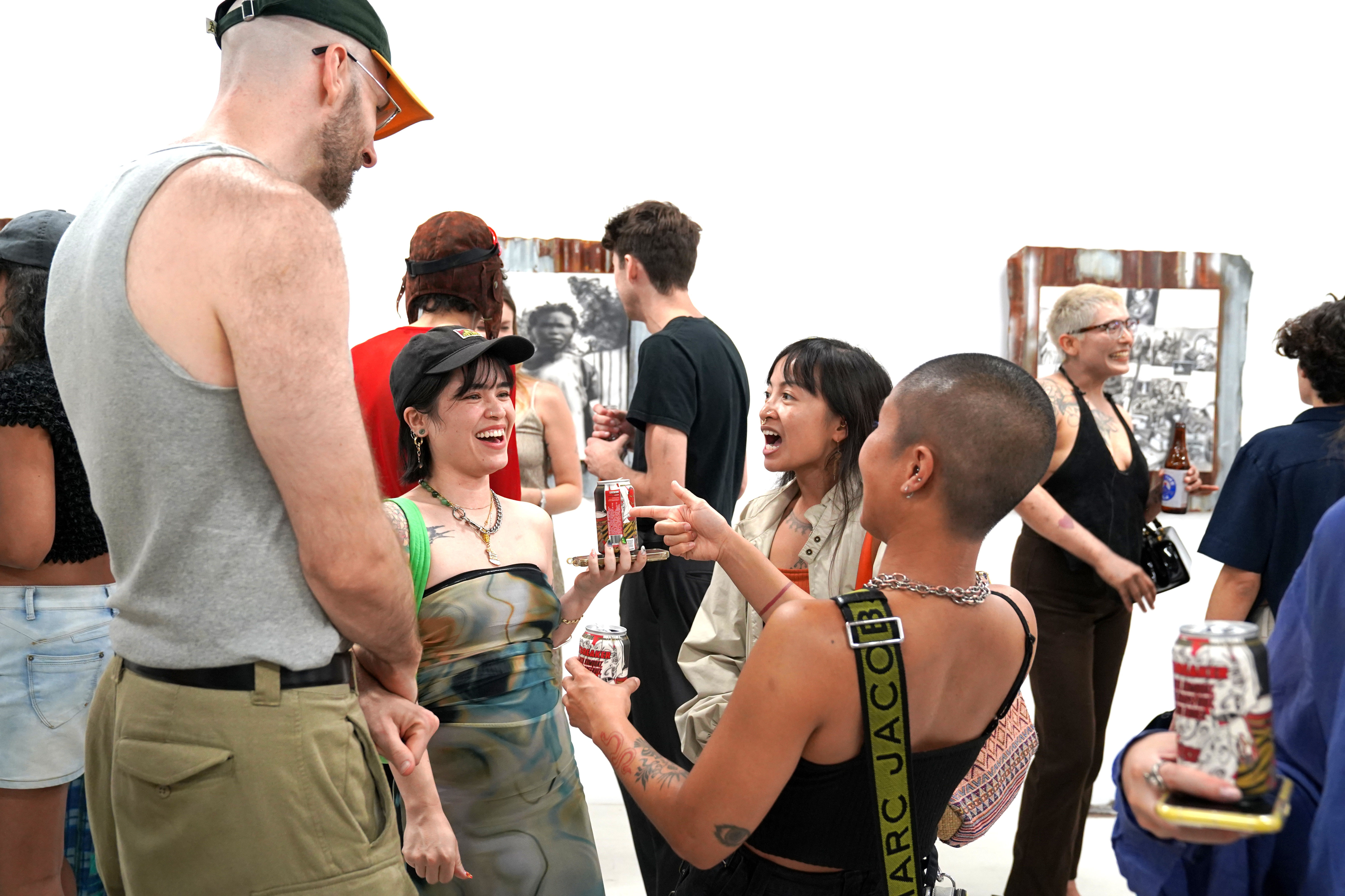 photo of an art gallery full of people