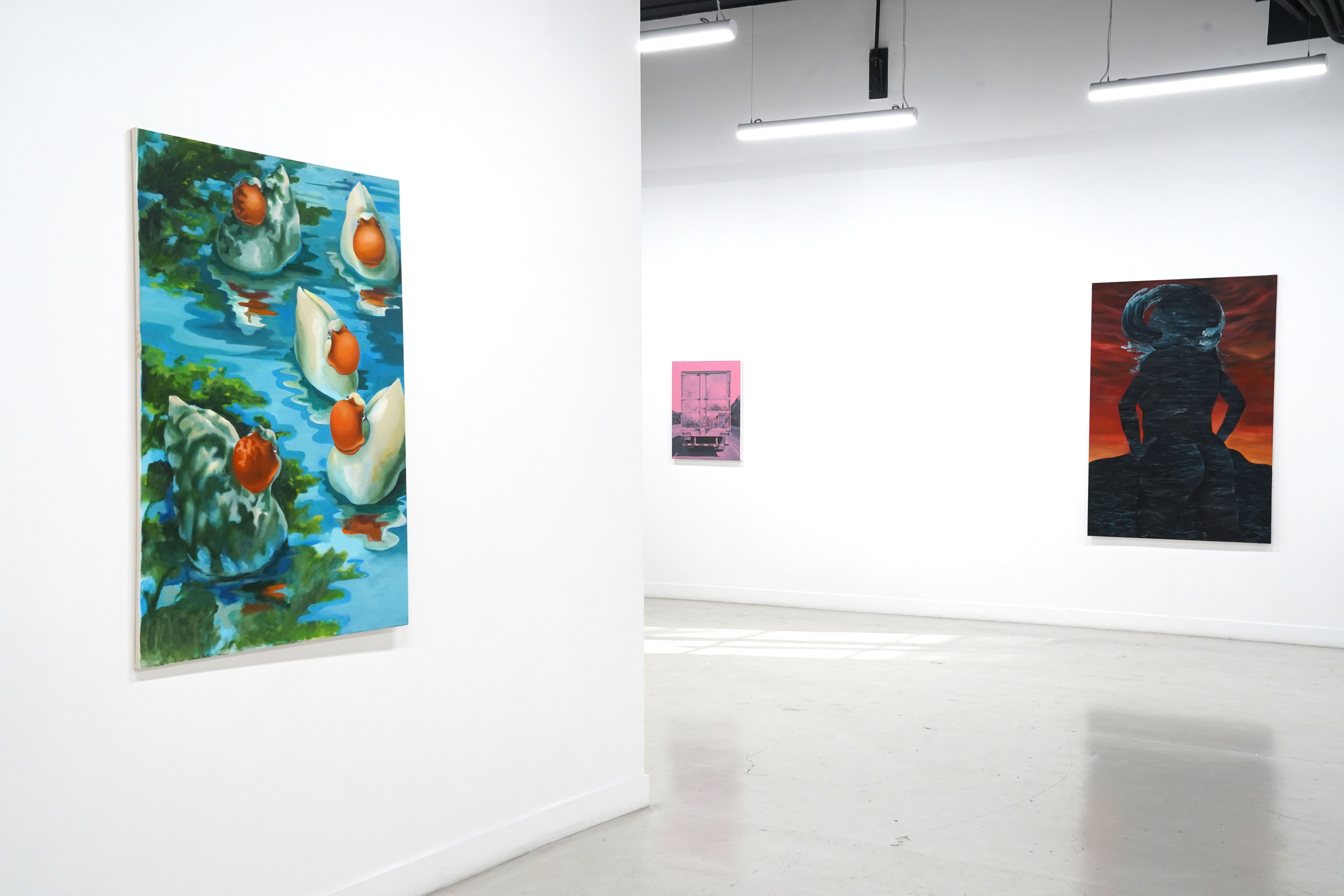 photo of the gallery with paintings hangiing on the wall