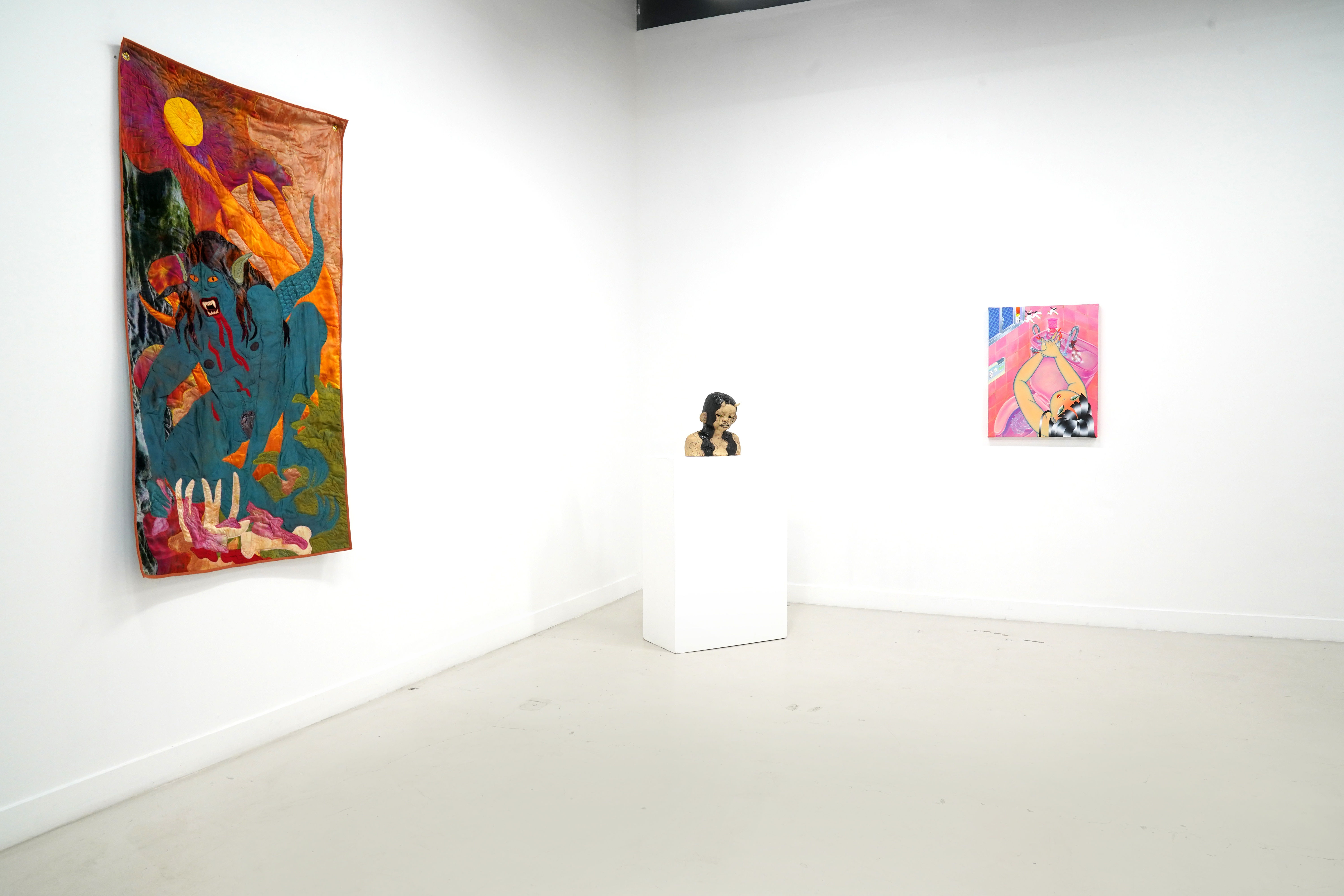 photo of the gallery with paintings hangiing on the wall