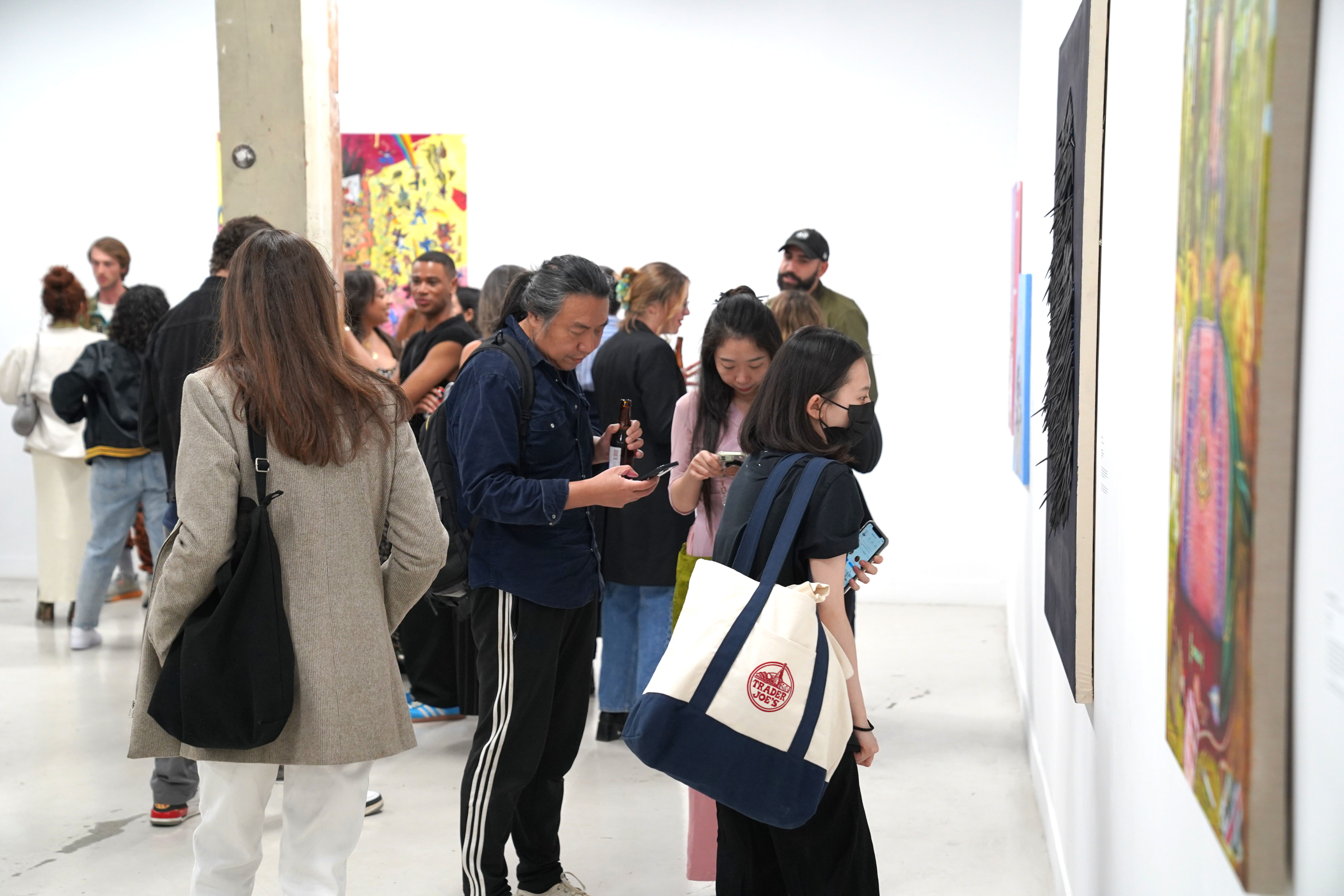 photo of a crowd of people in the art gallery