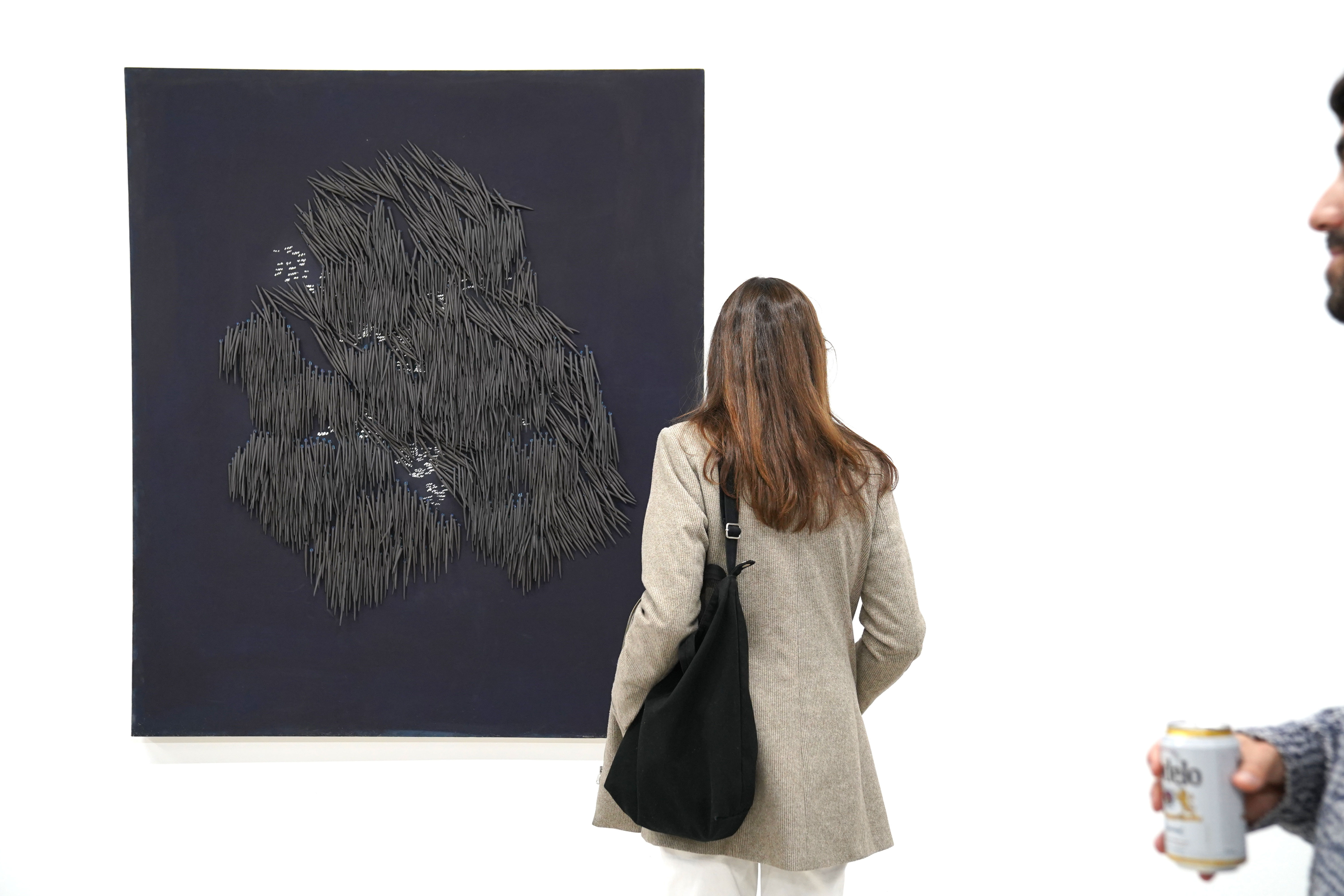 photo of a crowd of people in the art gallery