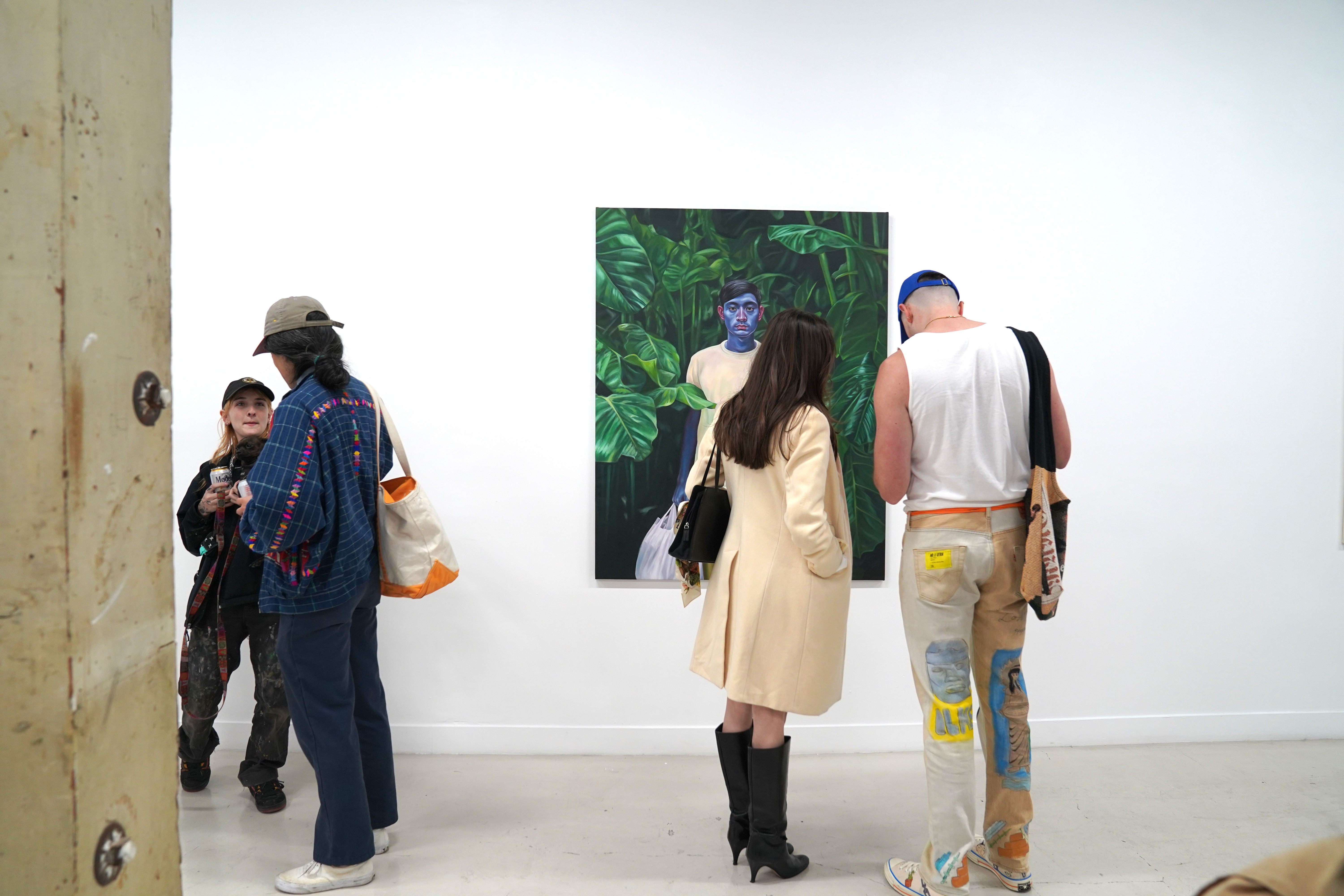 photo of a crowd of people in the art gallery