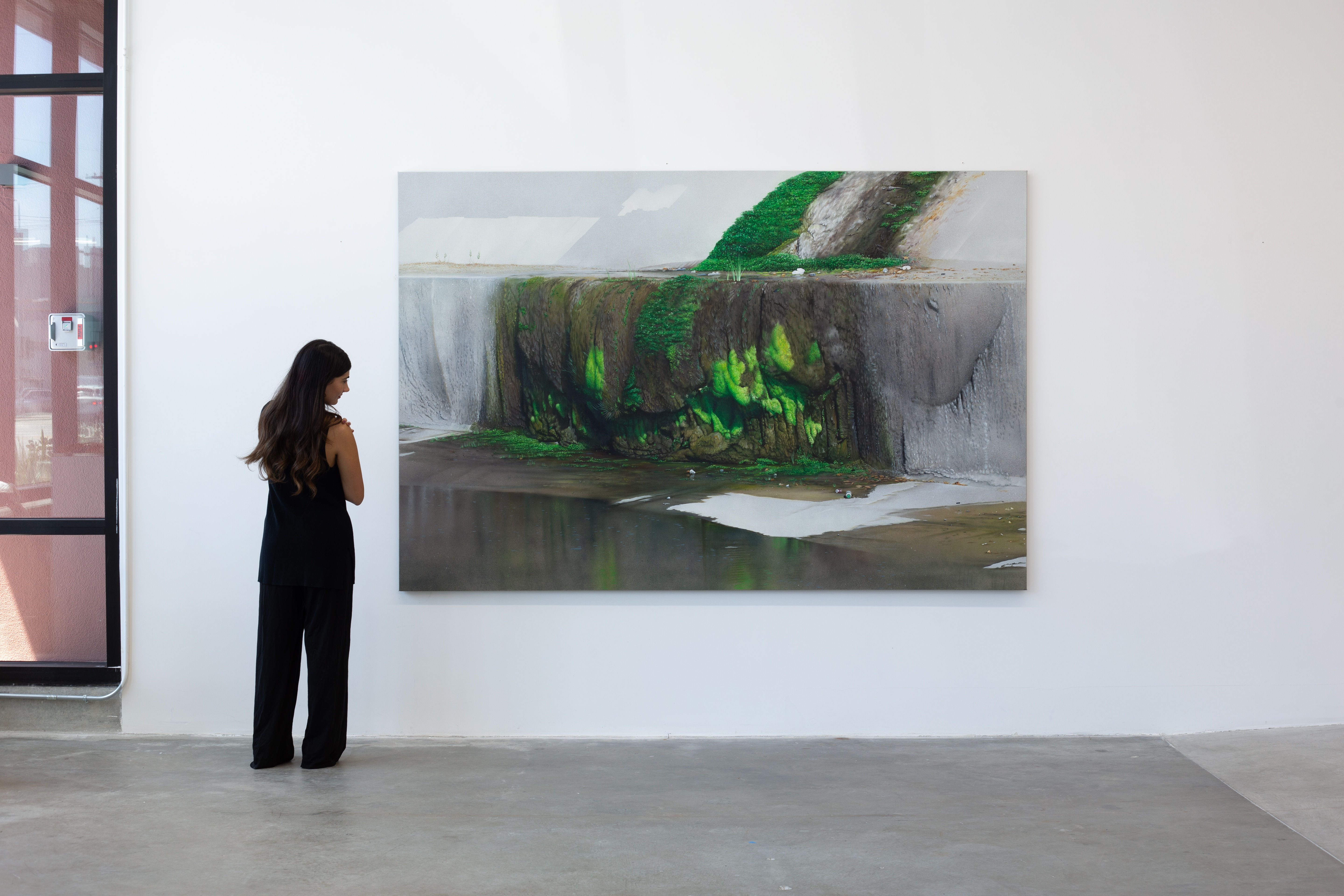 photo of the gallery with paintings hangiing on the wall