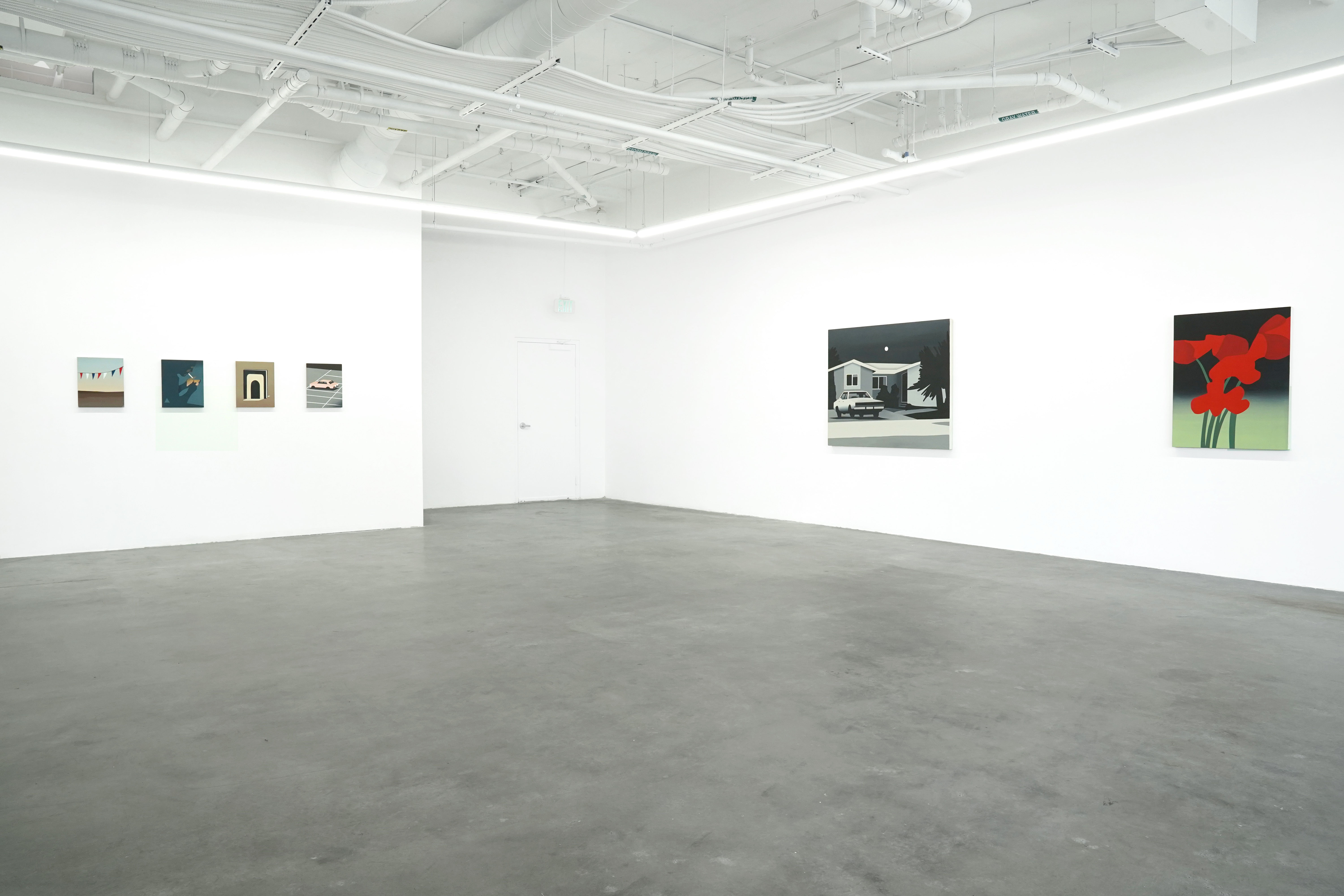 photo of the gallery with paintings hangiing on the wall