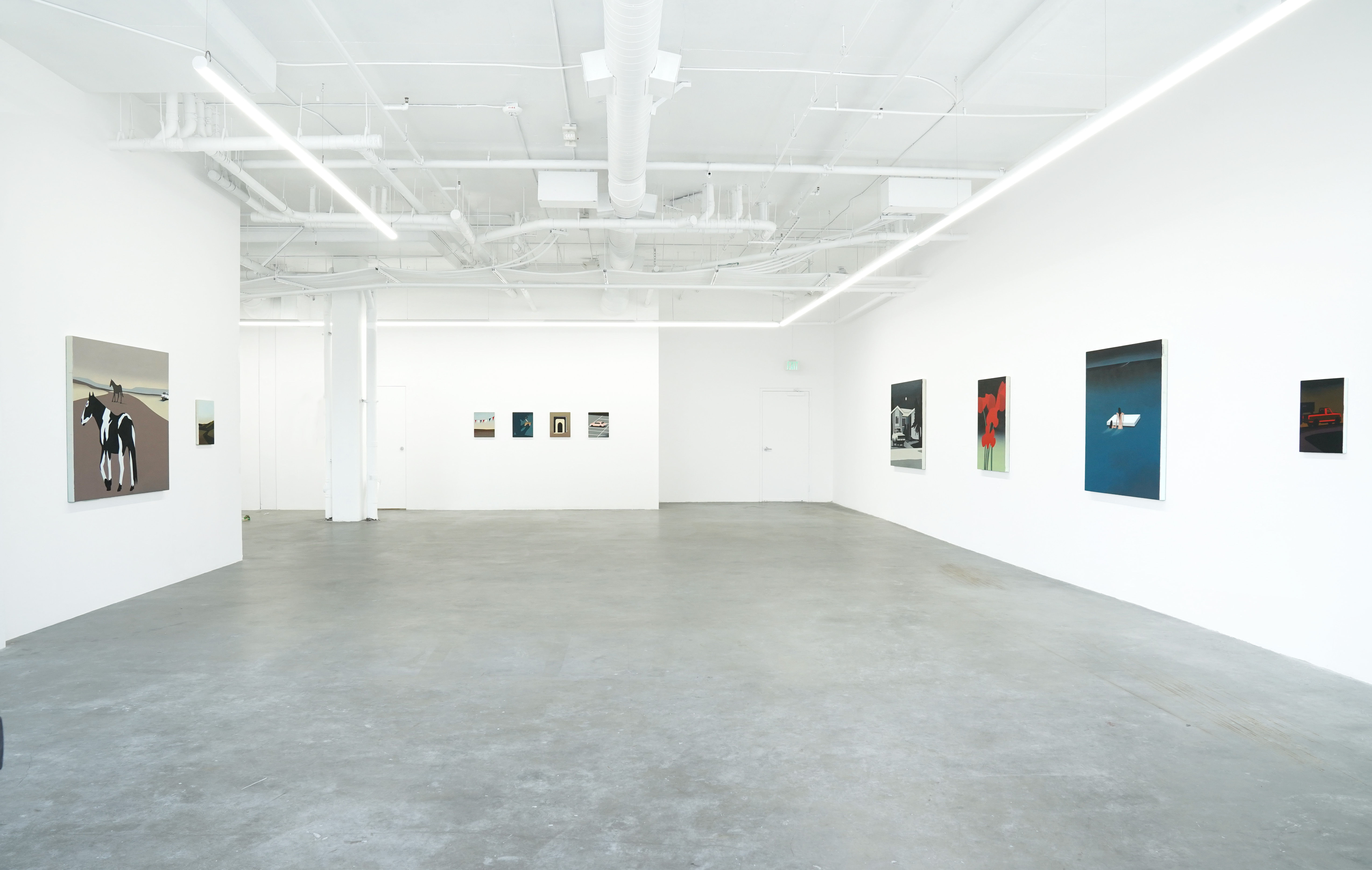 photo of the gallery with paintings hangiing on the wall