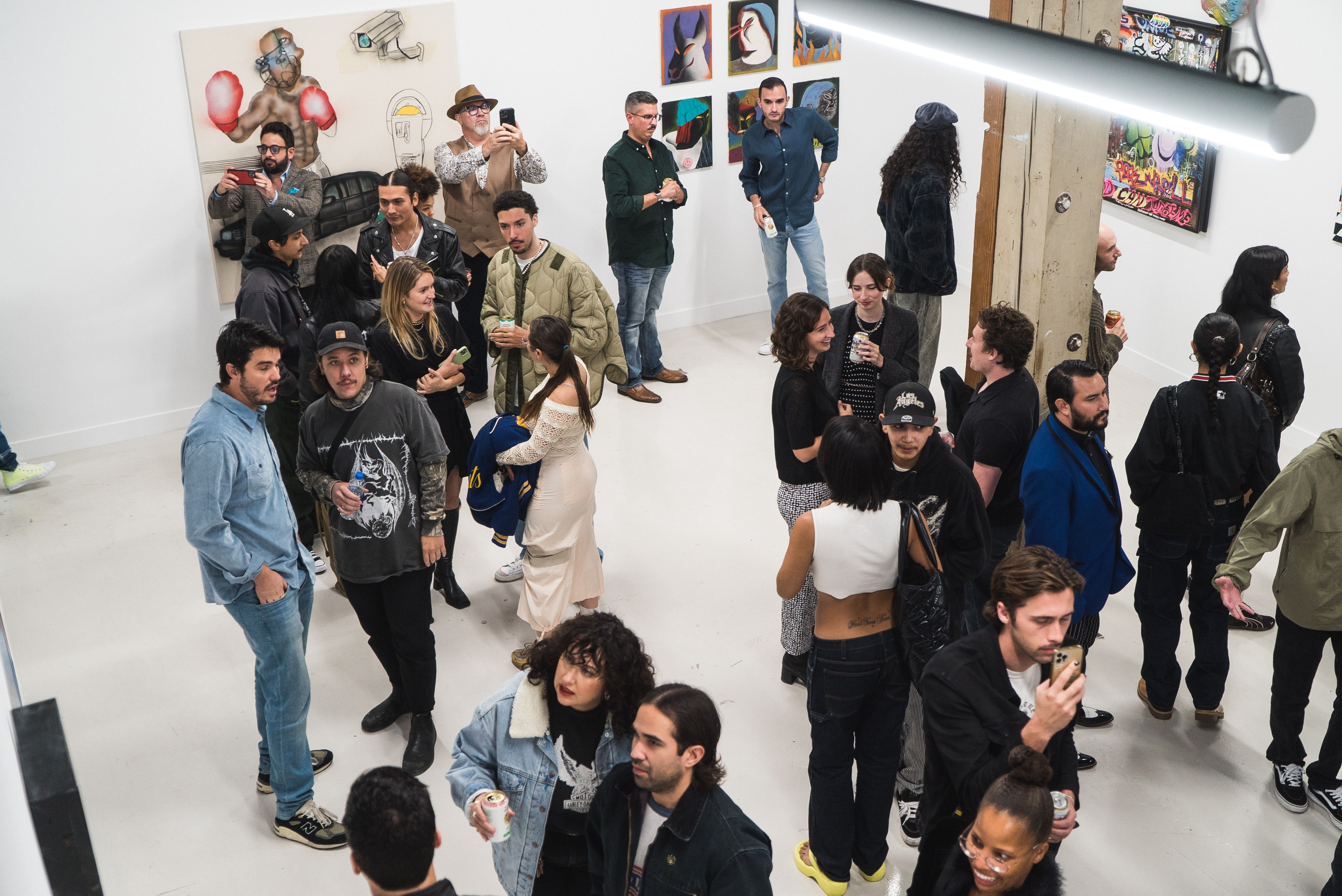 photo of a crowd of people in the art gallery