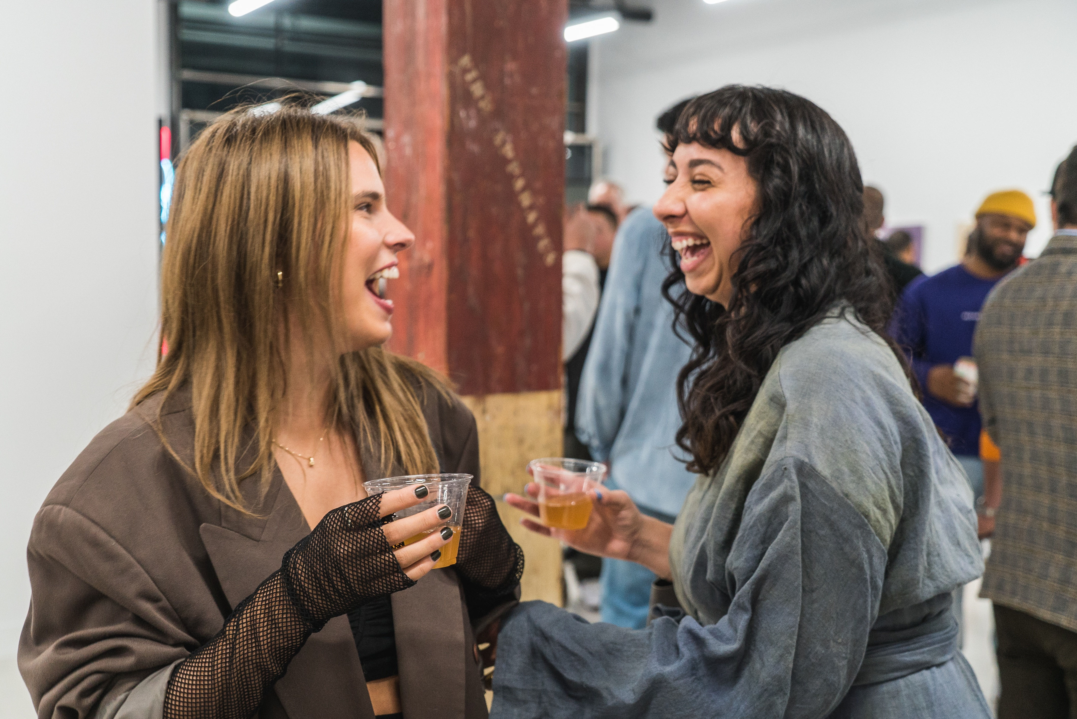 photo of a crowd of people in the art gallery