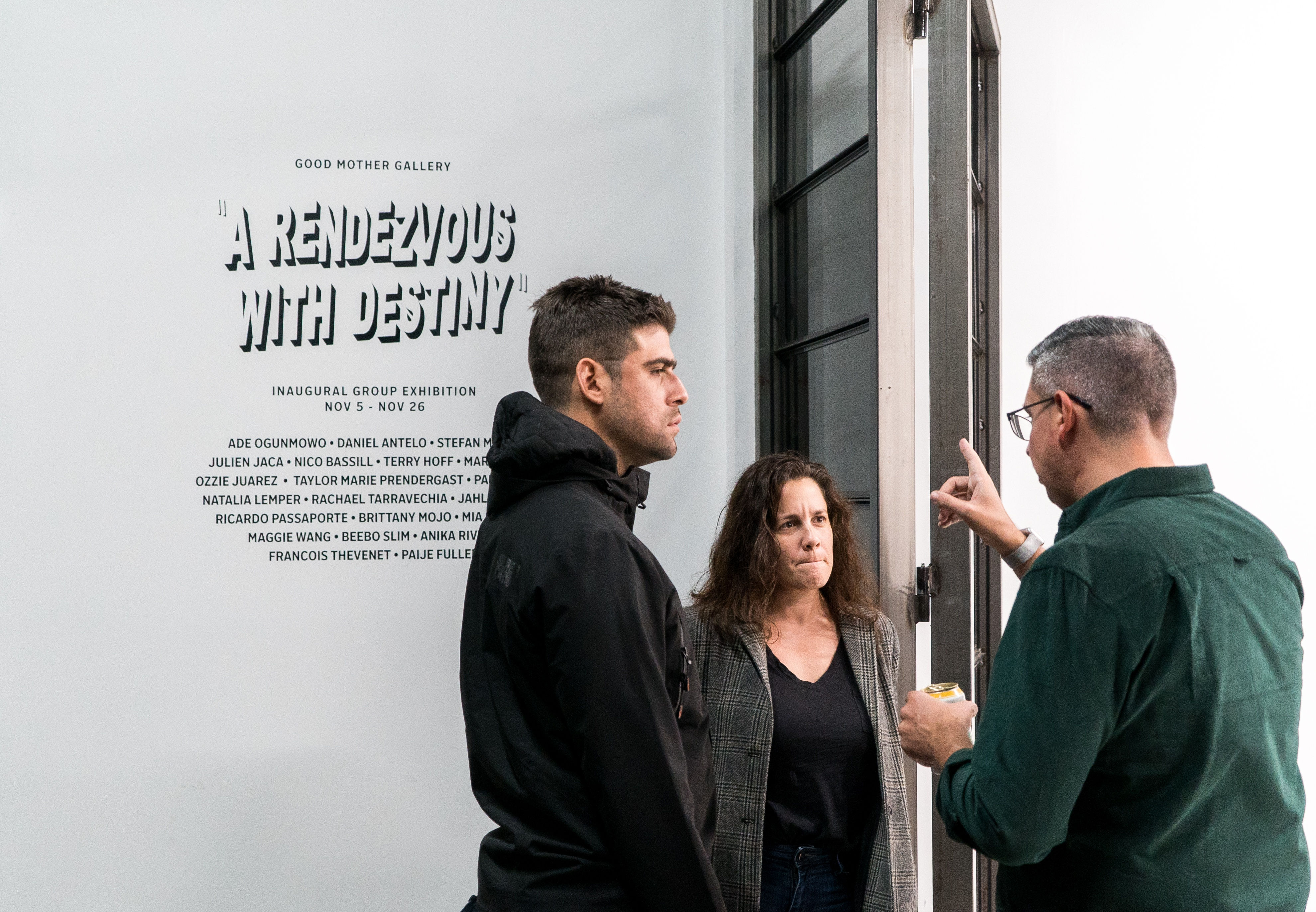 photo of three people standing outside the art gallery
