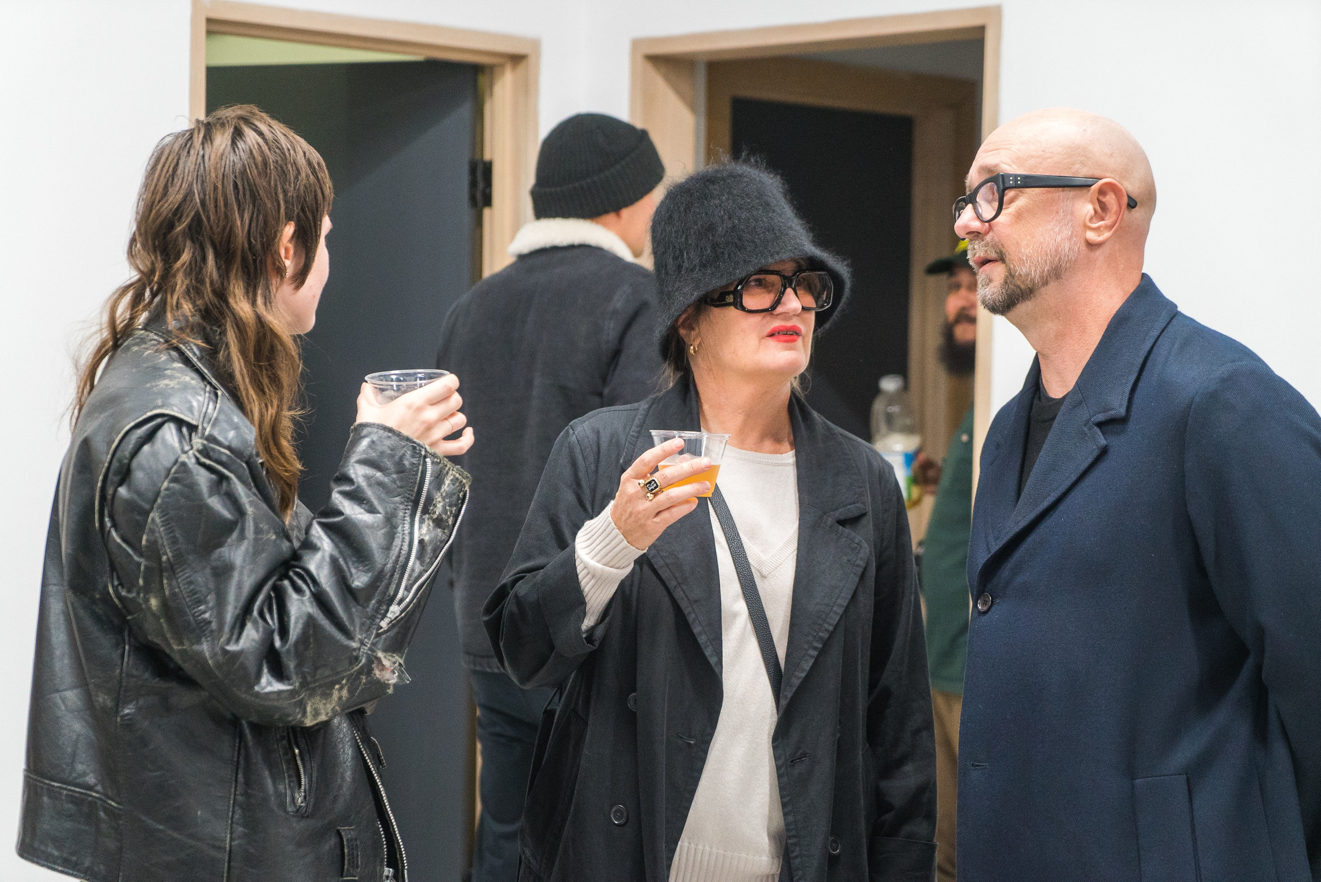 photo of a crowd of people in the art gallery