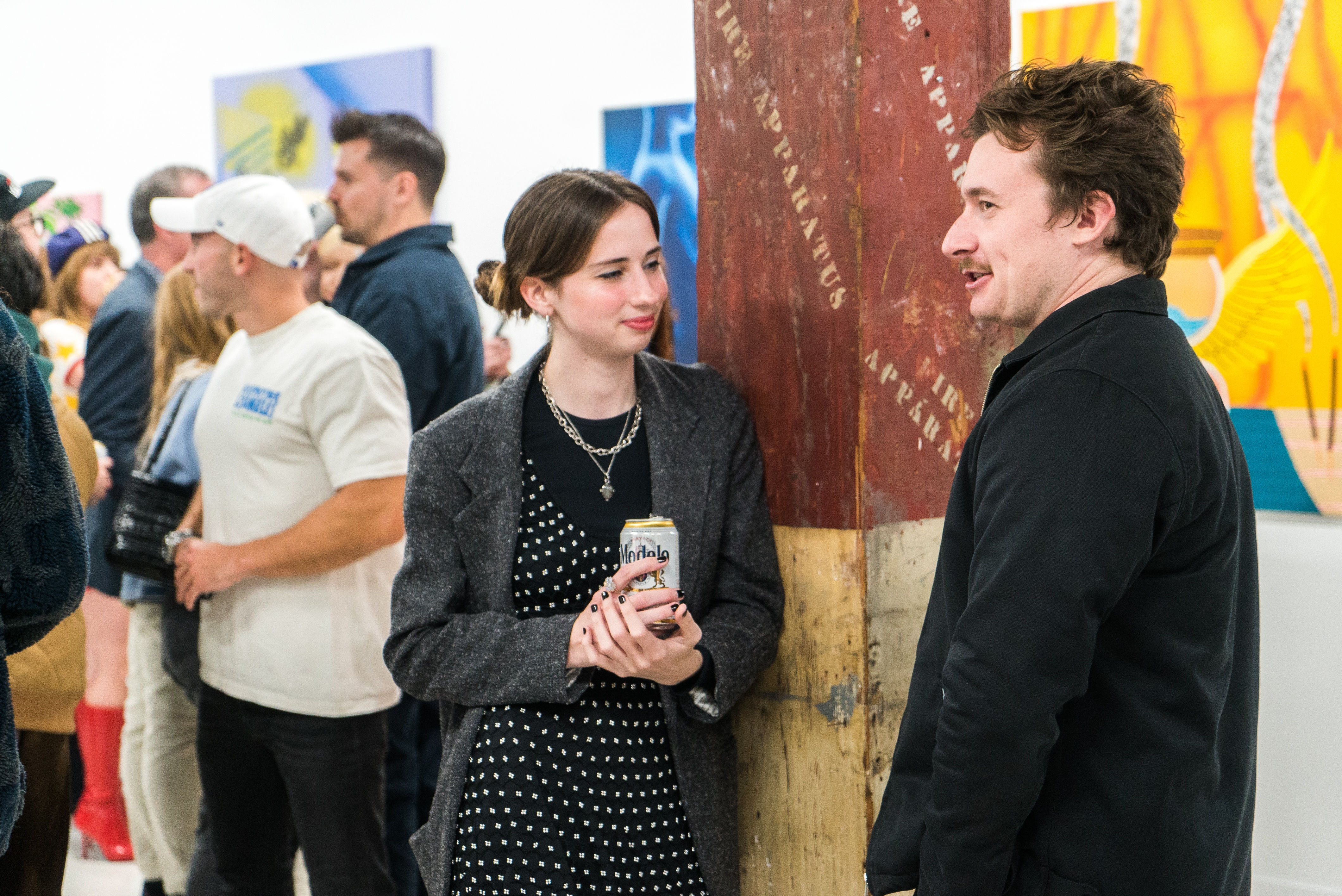 photo of a crowd of people in the art gallery