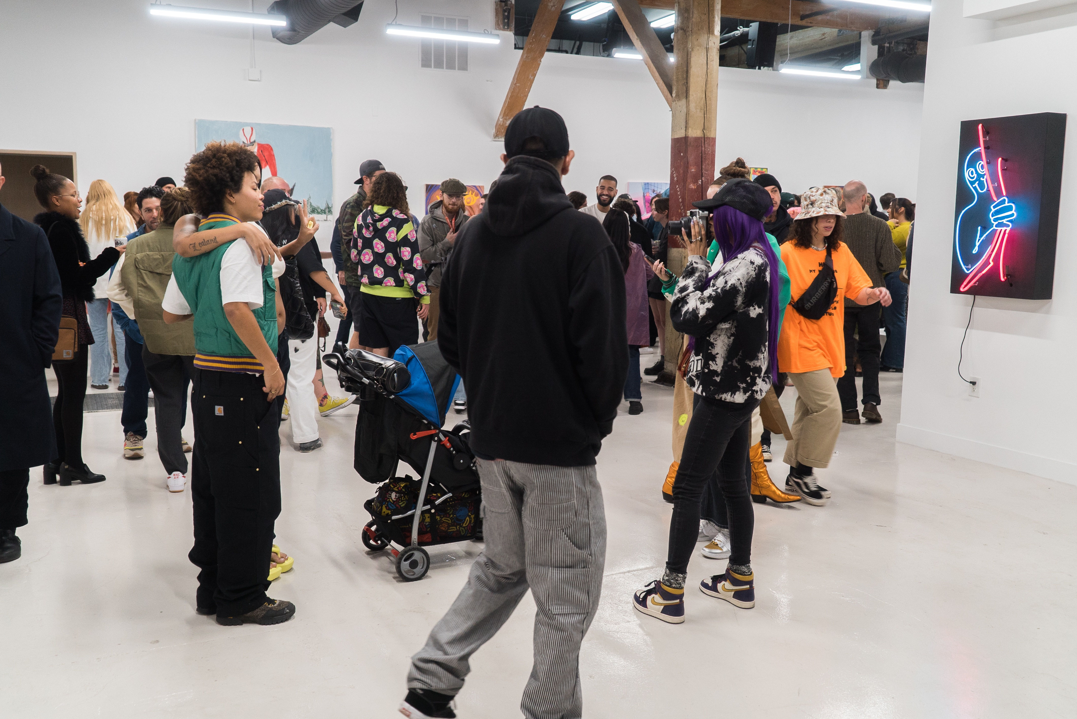 photo of a crowd of people in the art gallery