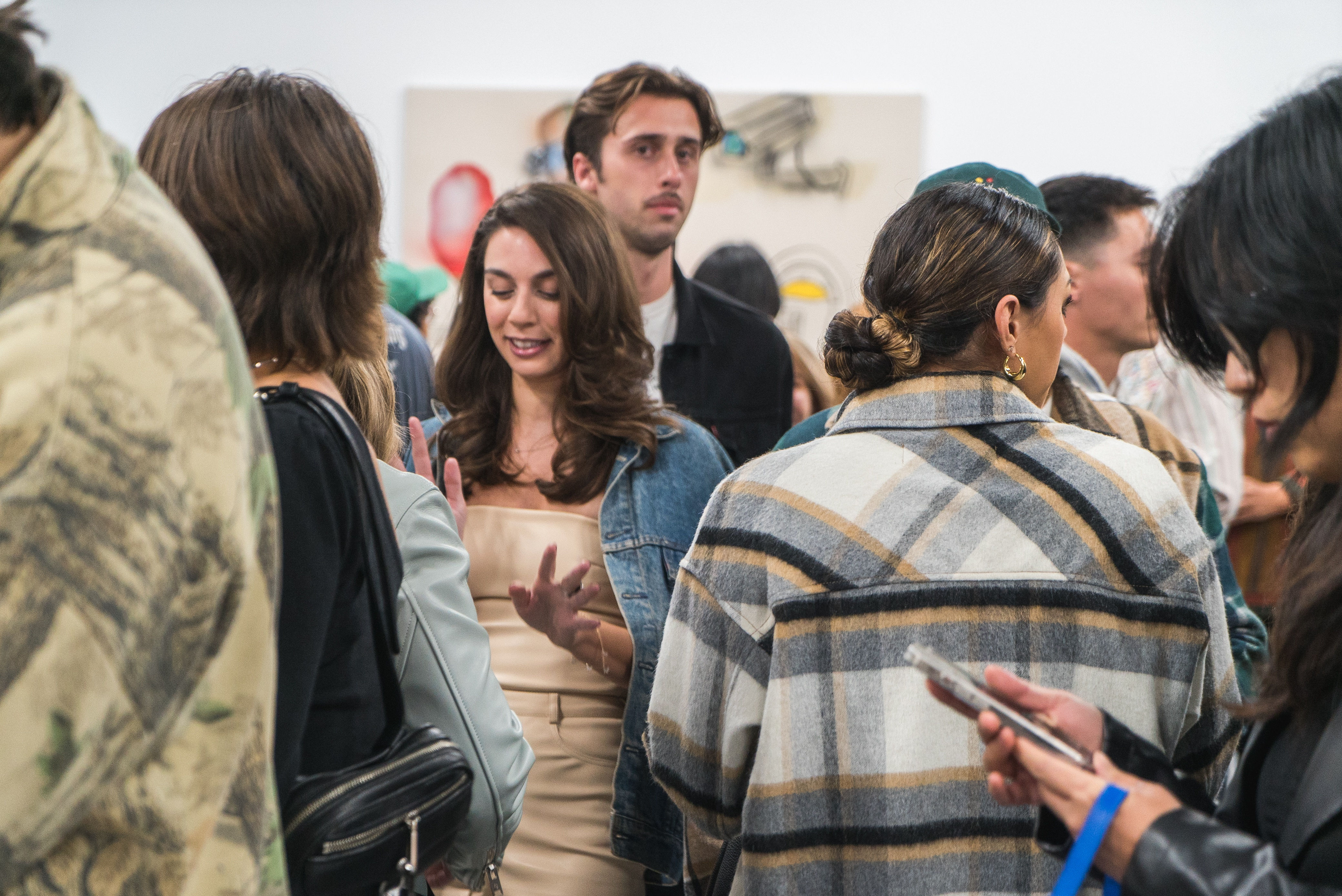 photo of a crowd of people in the art gallery
