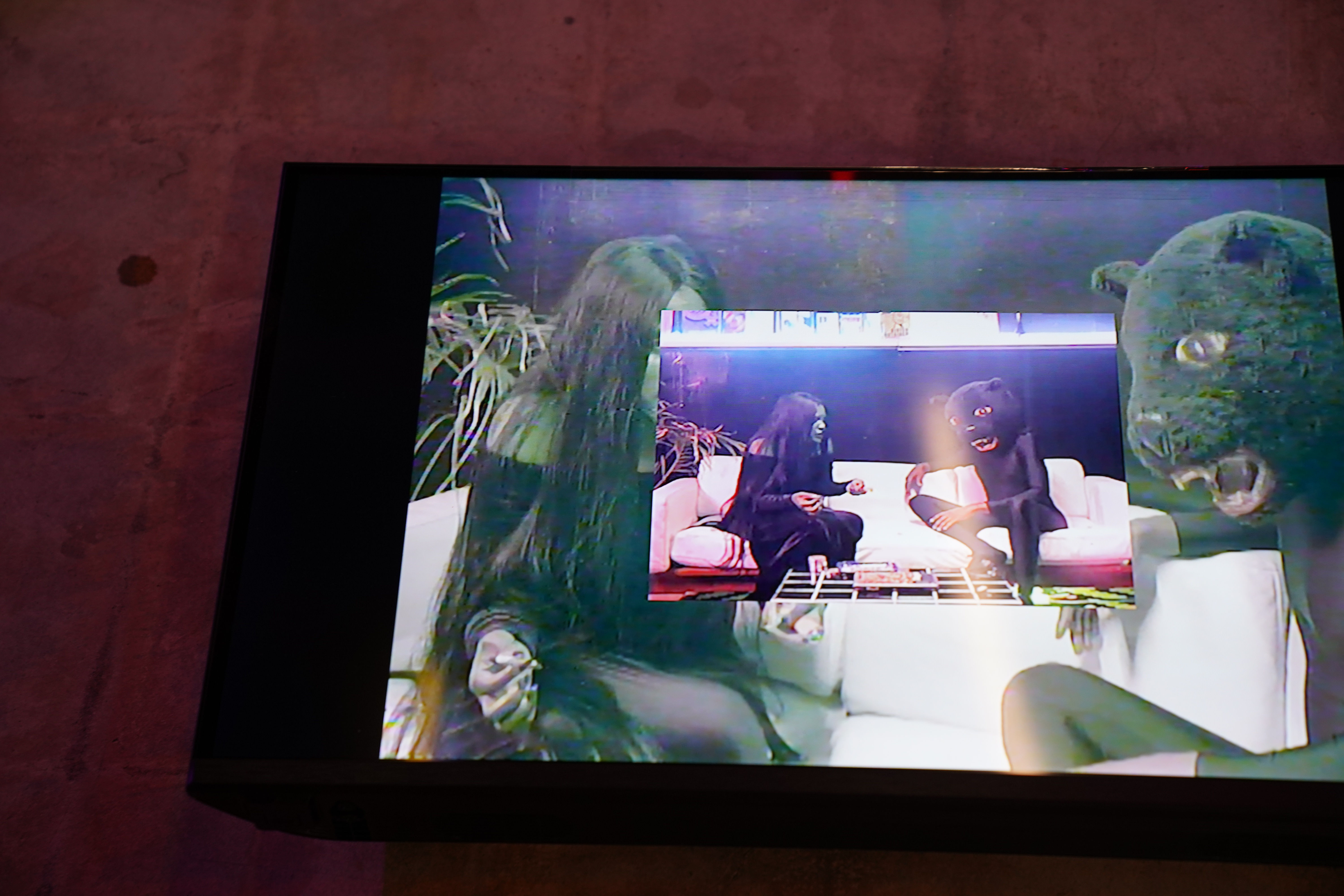 photo of a performance video on a tv screen by Devin Troy Strother
