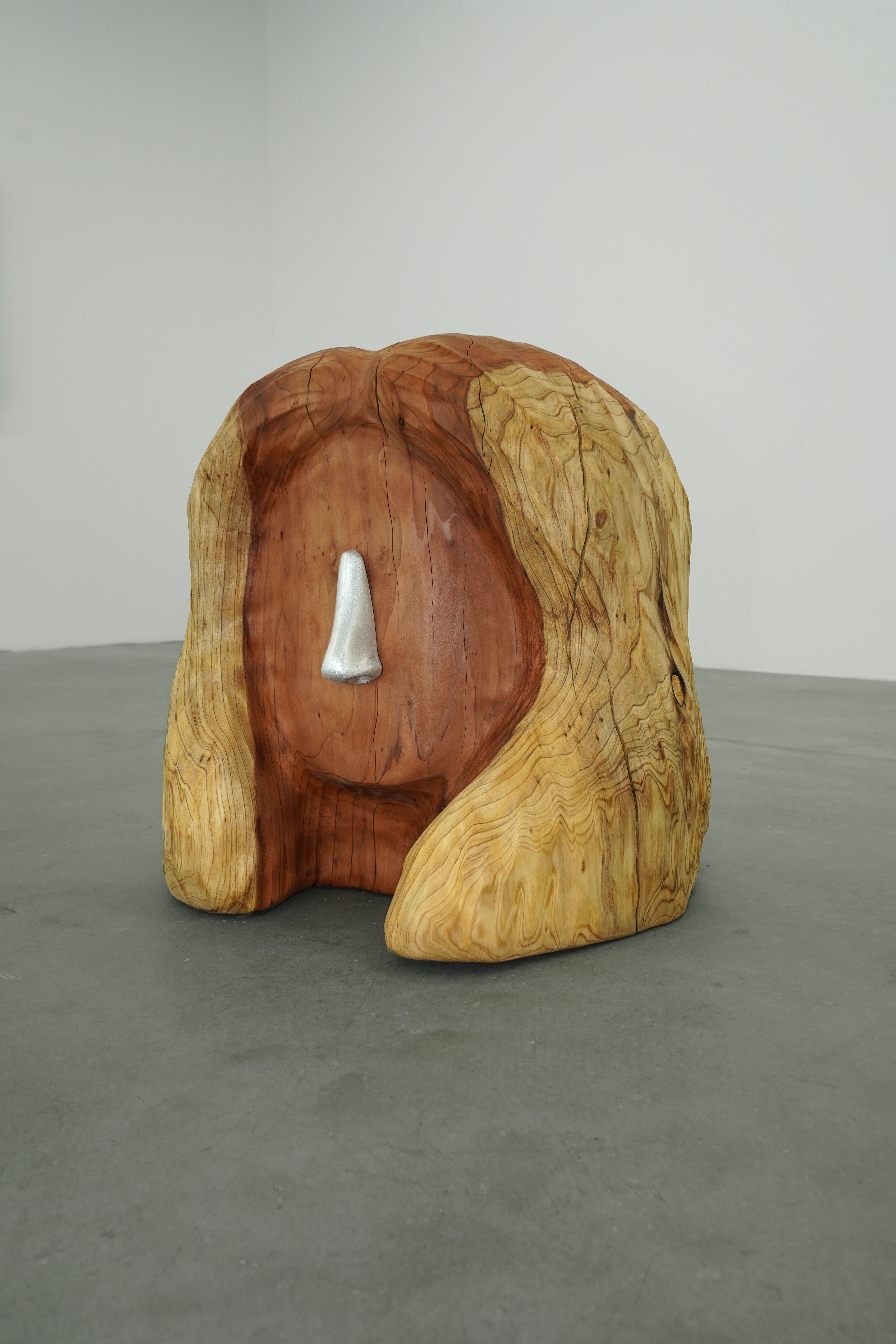 photo of a wooden stool shaped like a human head