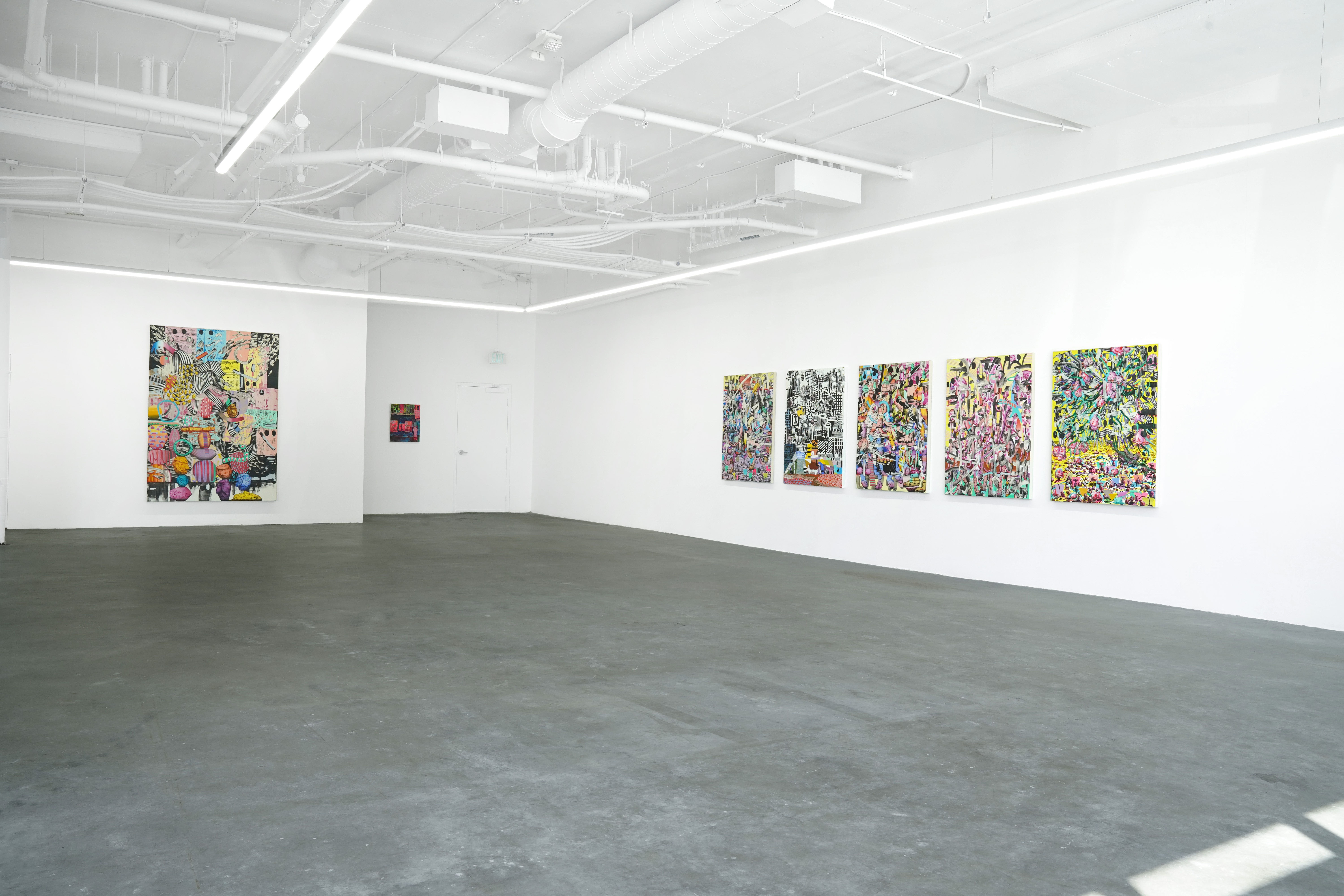 photo of installation of the gallery with paintings on the walls by Carlson Hatton