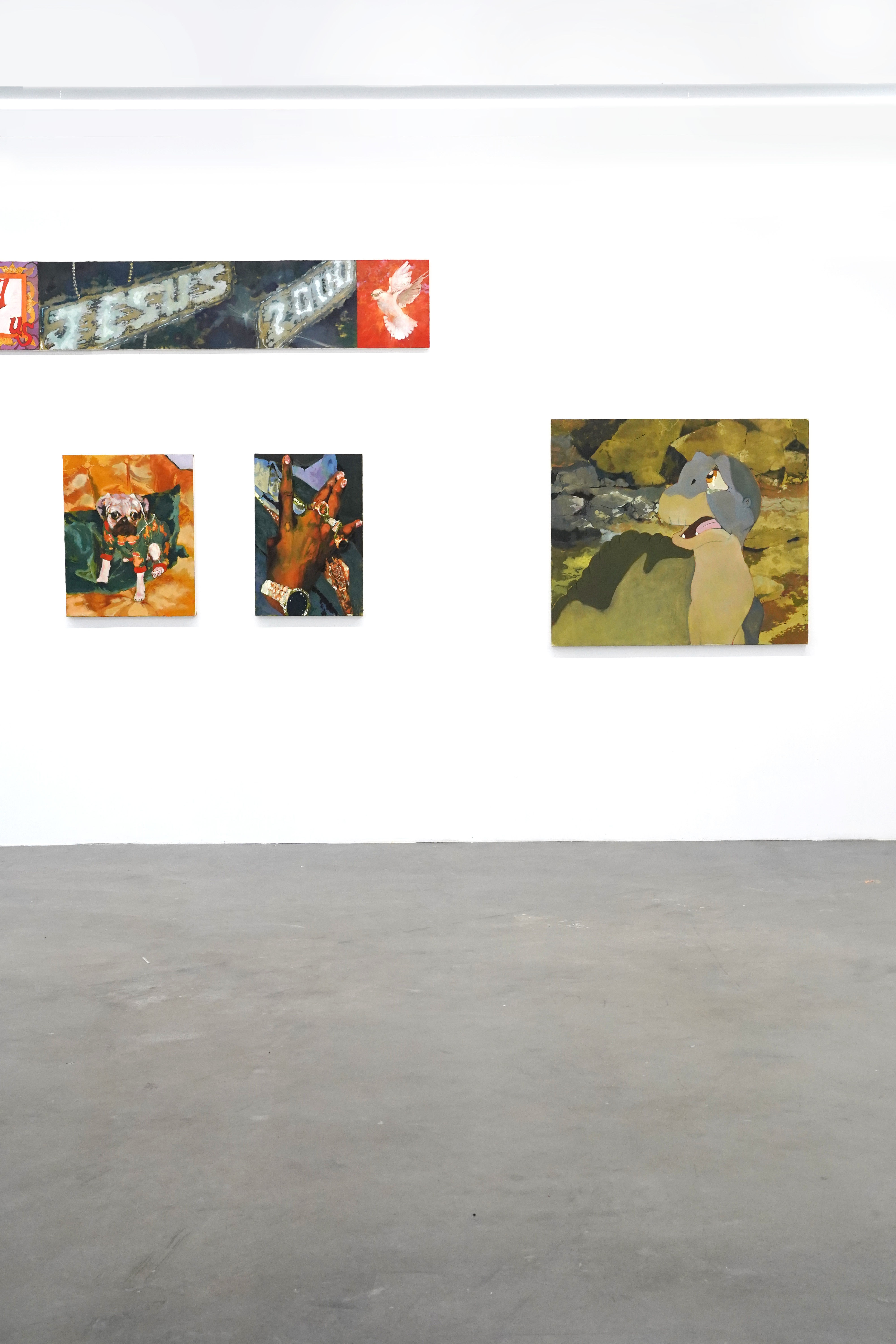 photo of the gallery with paintings hangiing on the wall