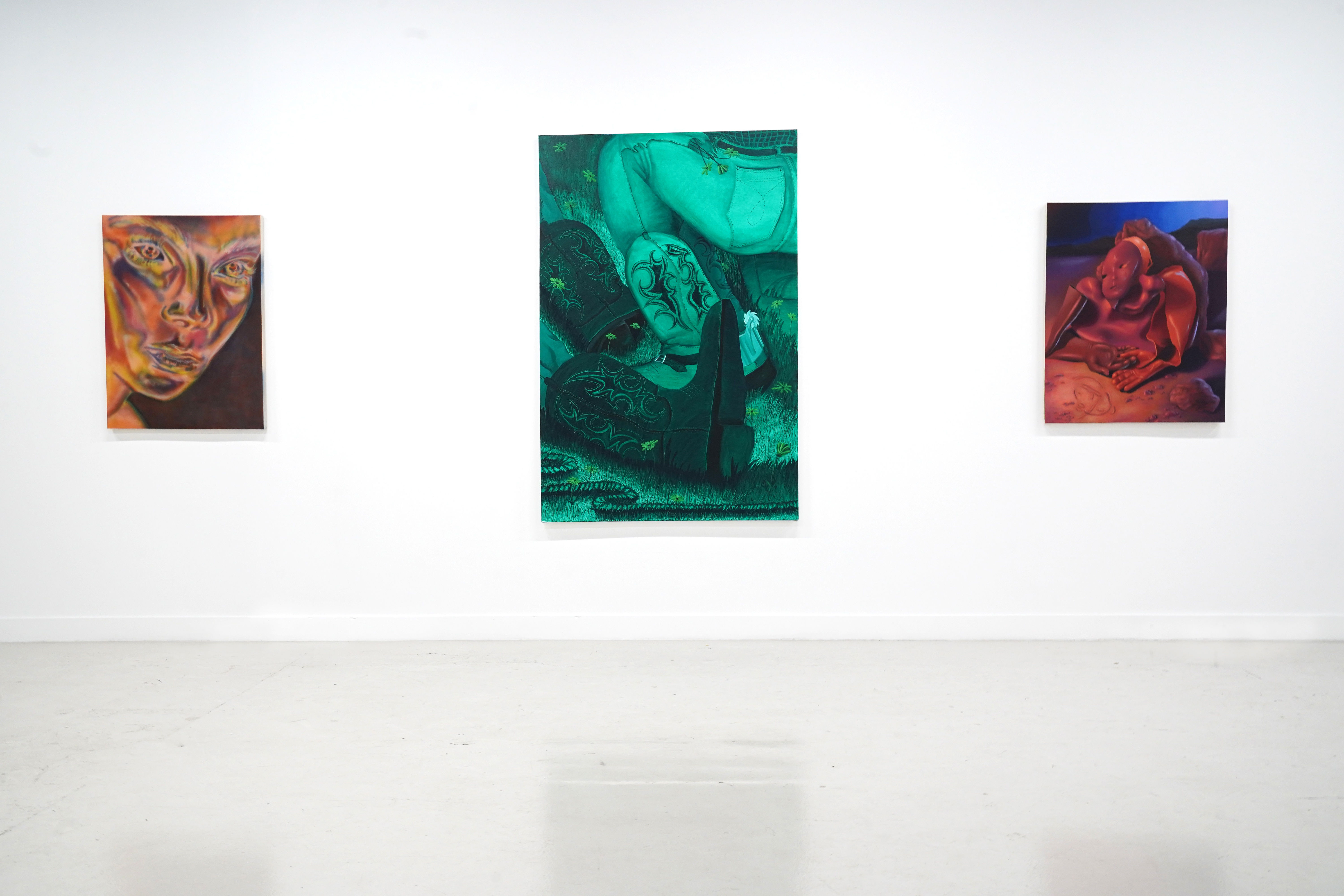 photo of the gallery with paintings hangiing on the wall