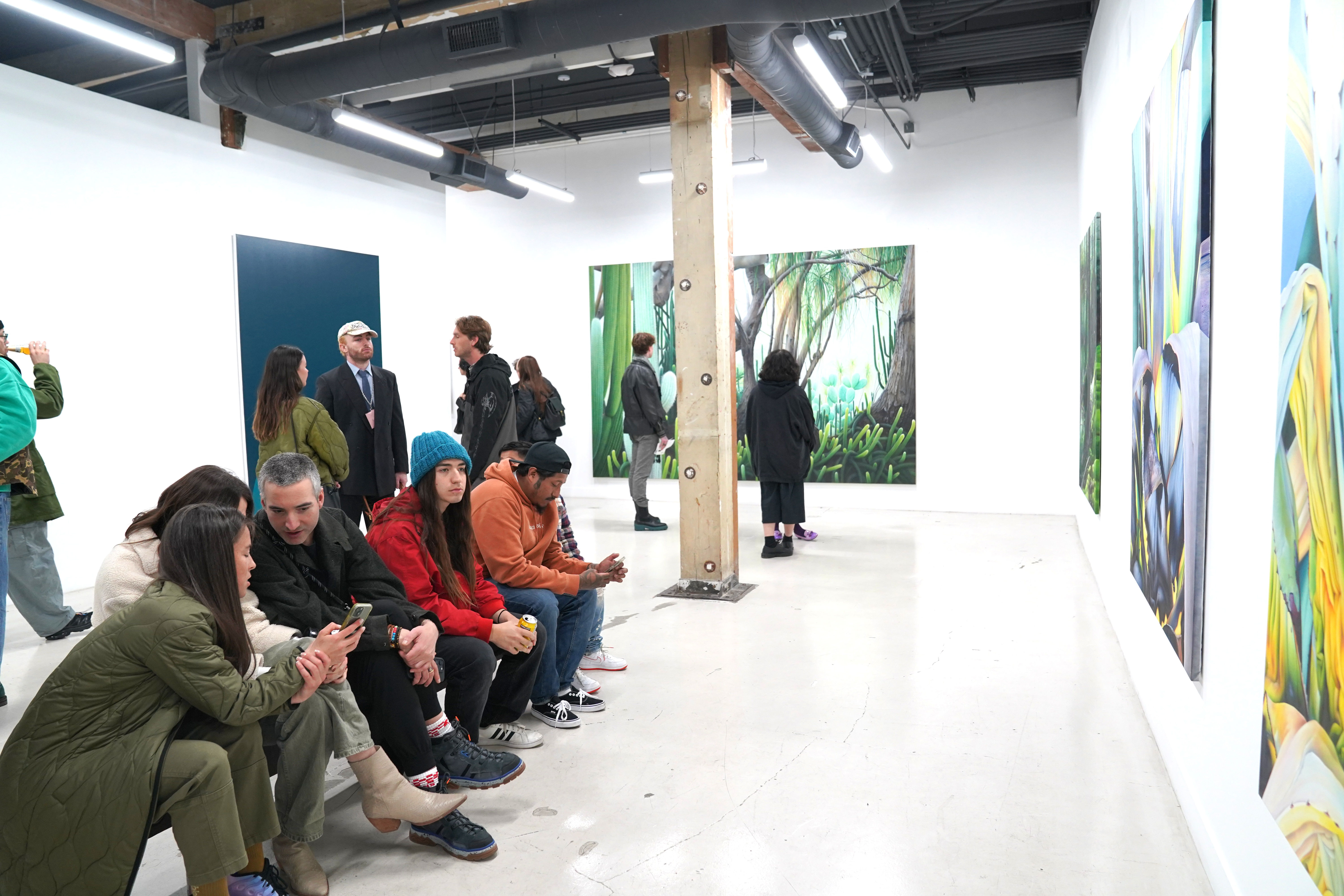 installation image of Adele Renault and Chad Hasegawa paintings in the gallery