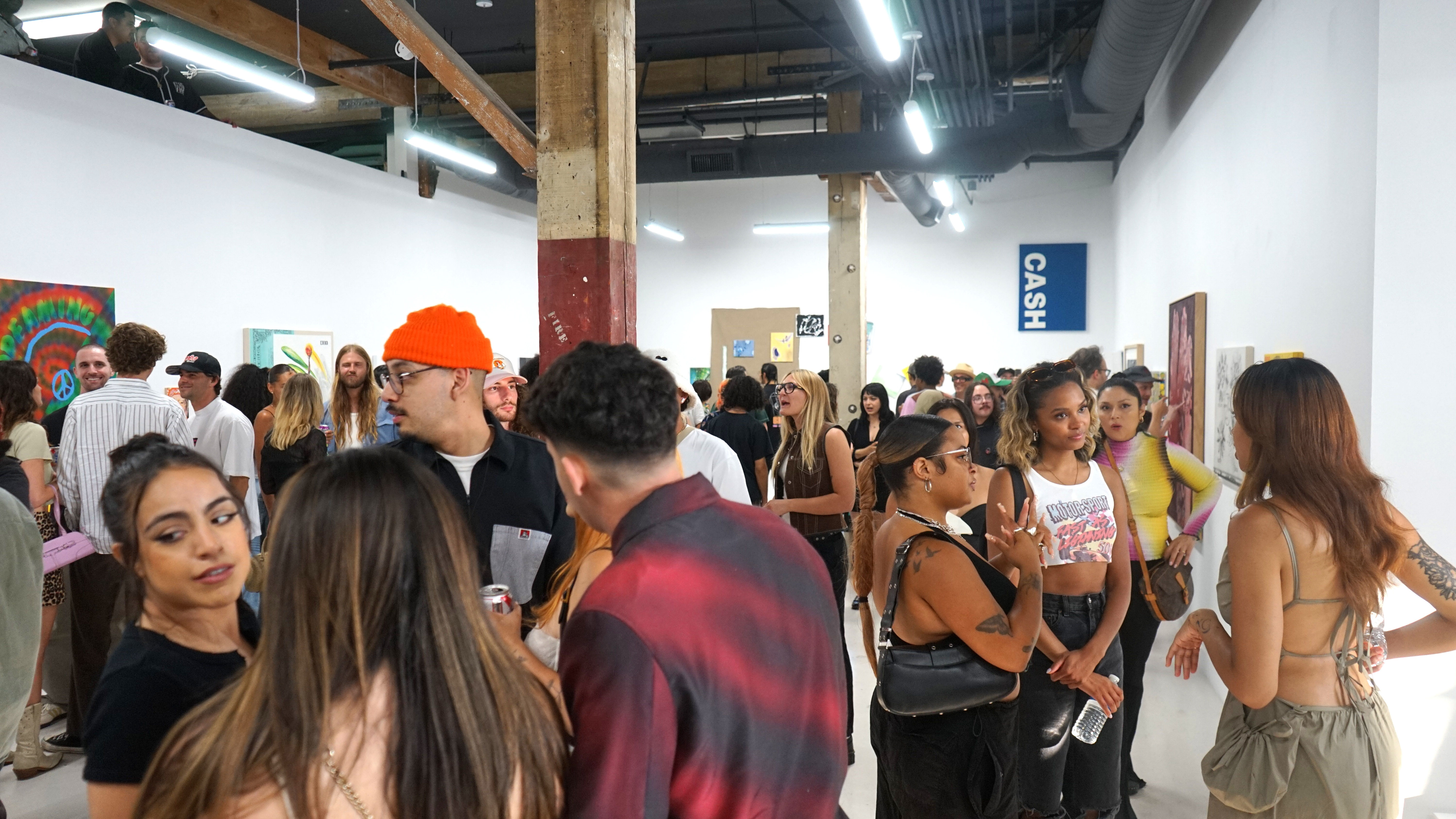 photo of a crowd of people in the art gallery