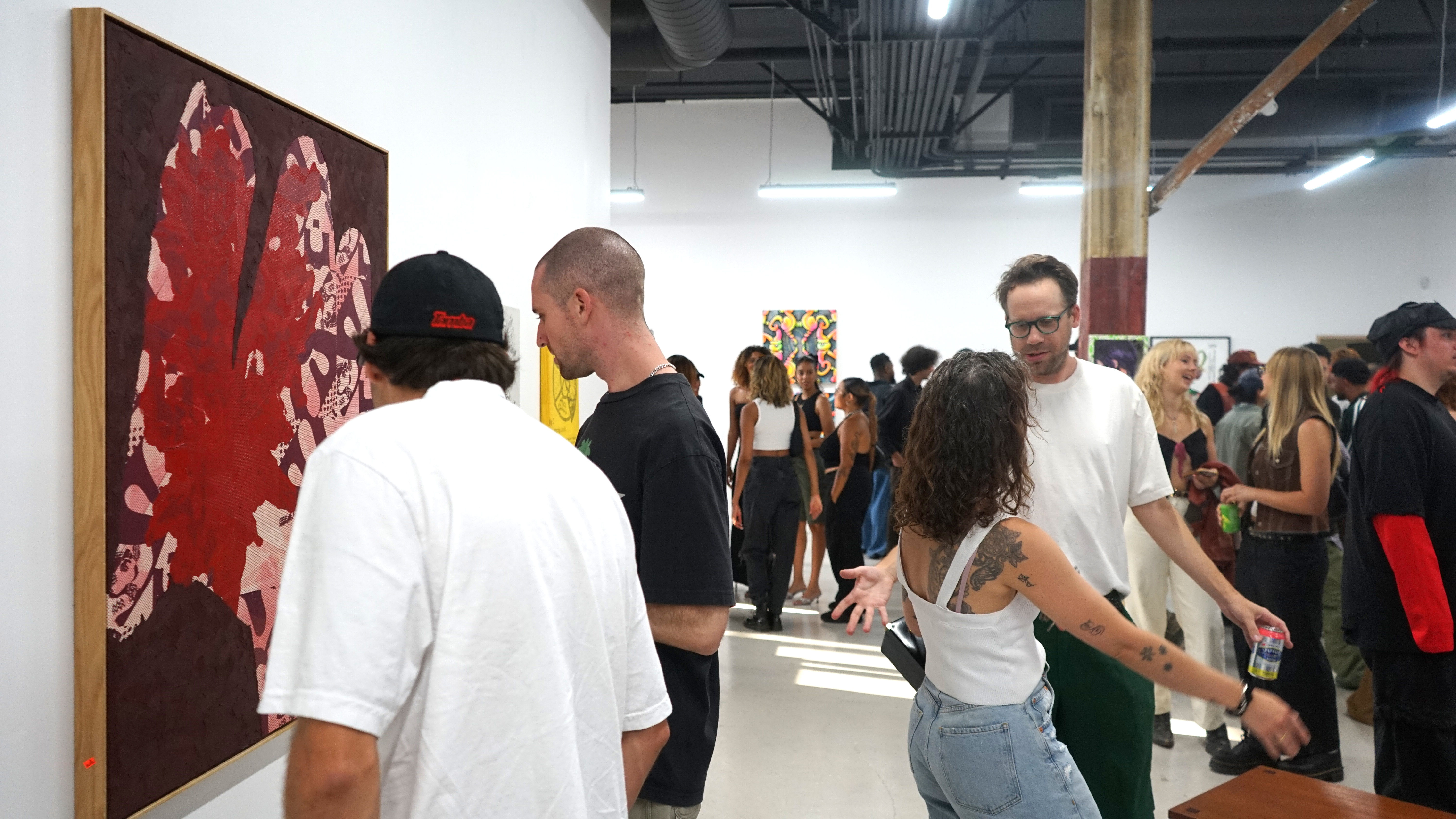 photo of a crowd of people in the art gallery