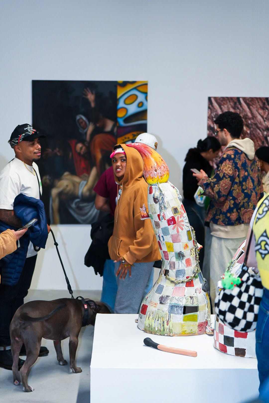 photo of a crowd of people in the art gallery