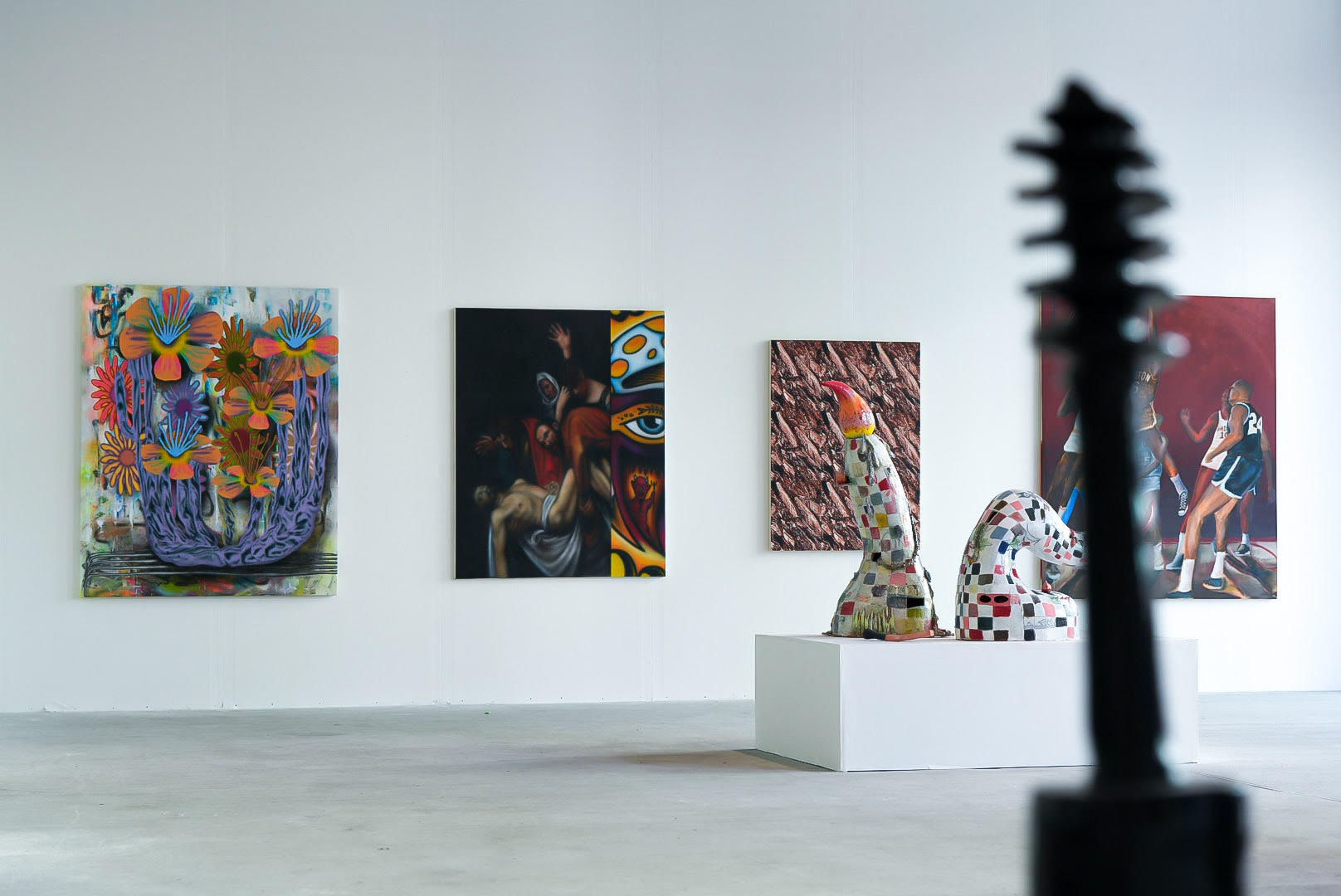 photo of an art gallery full of people