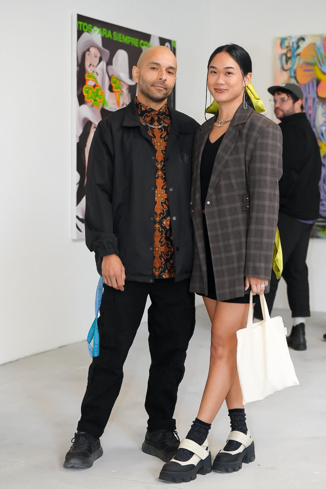 photo of an art gallery full of people