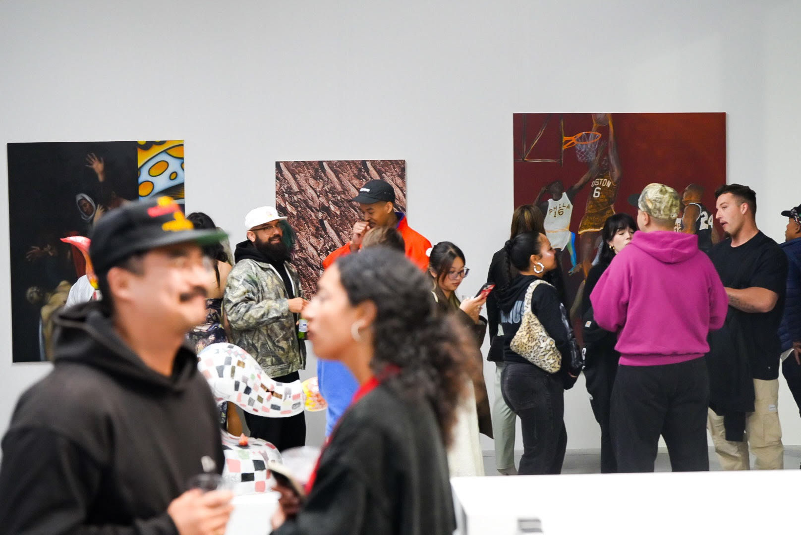 photo of a crowd of people in the art gallery