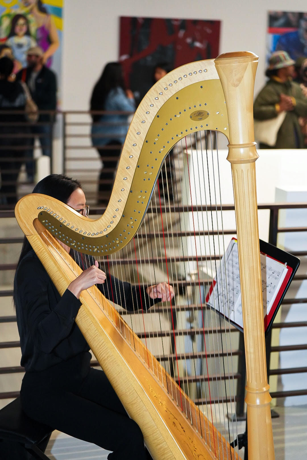 photo of a crowd of people in the art gallery