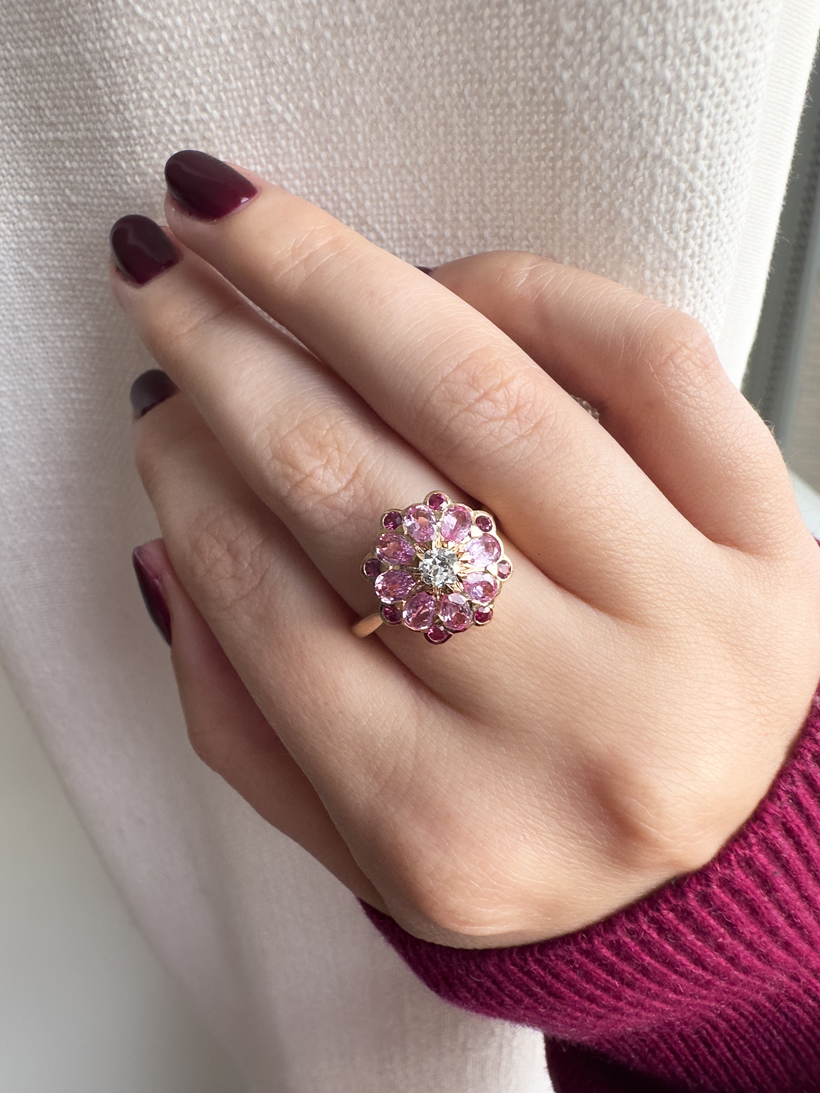 Aril Jewels antique old cut diamond, pink sapphire & ruby Rose ring in 18k rose gold. Pictured on hand