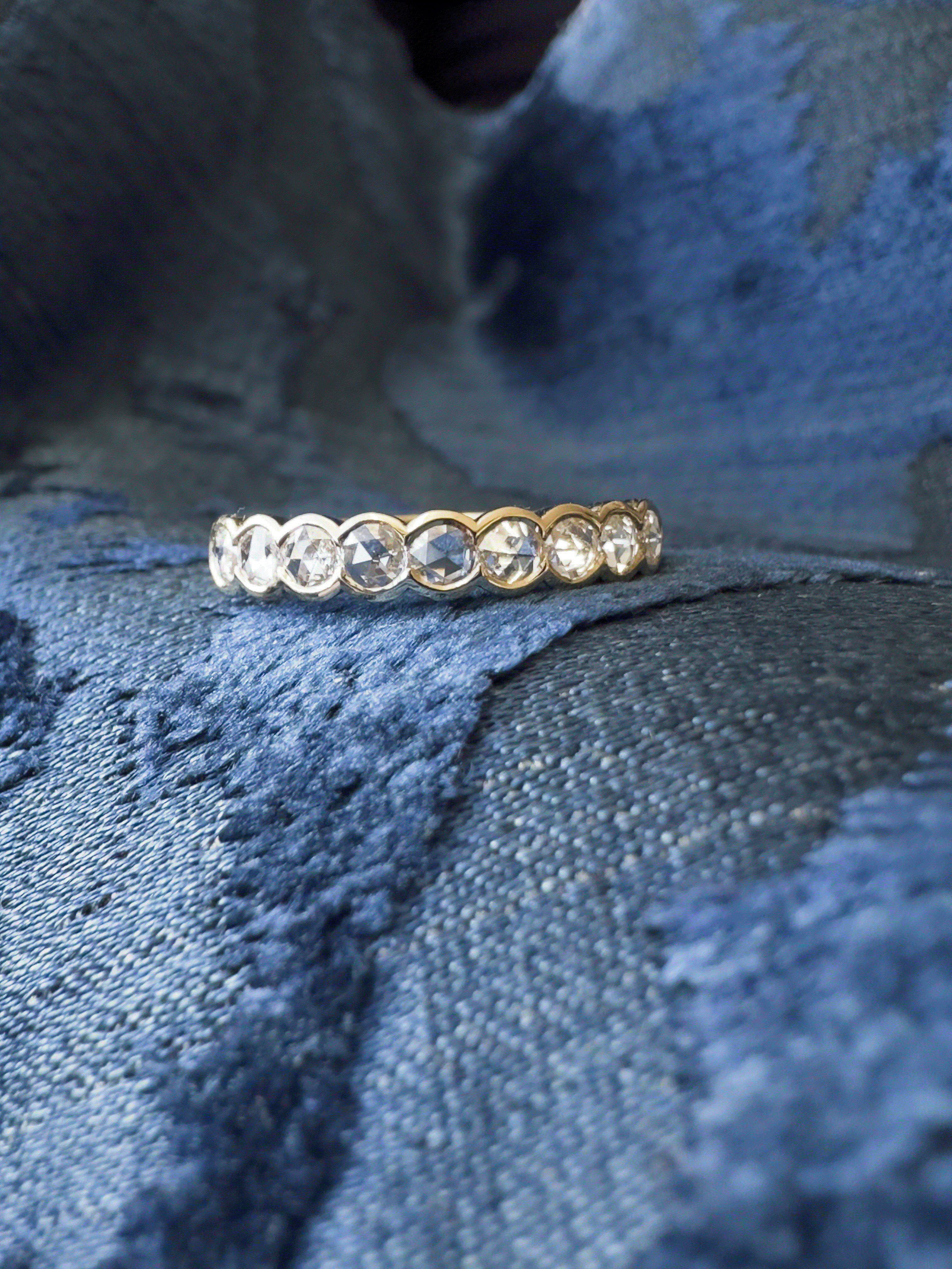 Heirloom quality rose-cut diamond eternity ring with rubover settings of 18k yellow gold