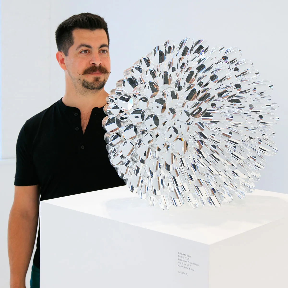 Dylan Martinez with Mach 8 glass sculpture