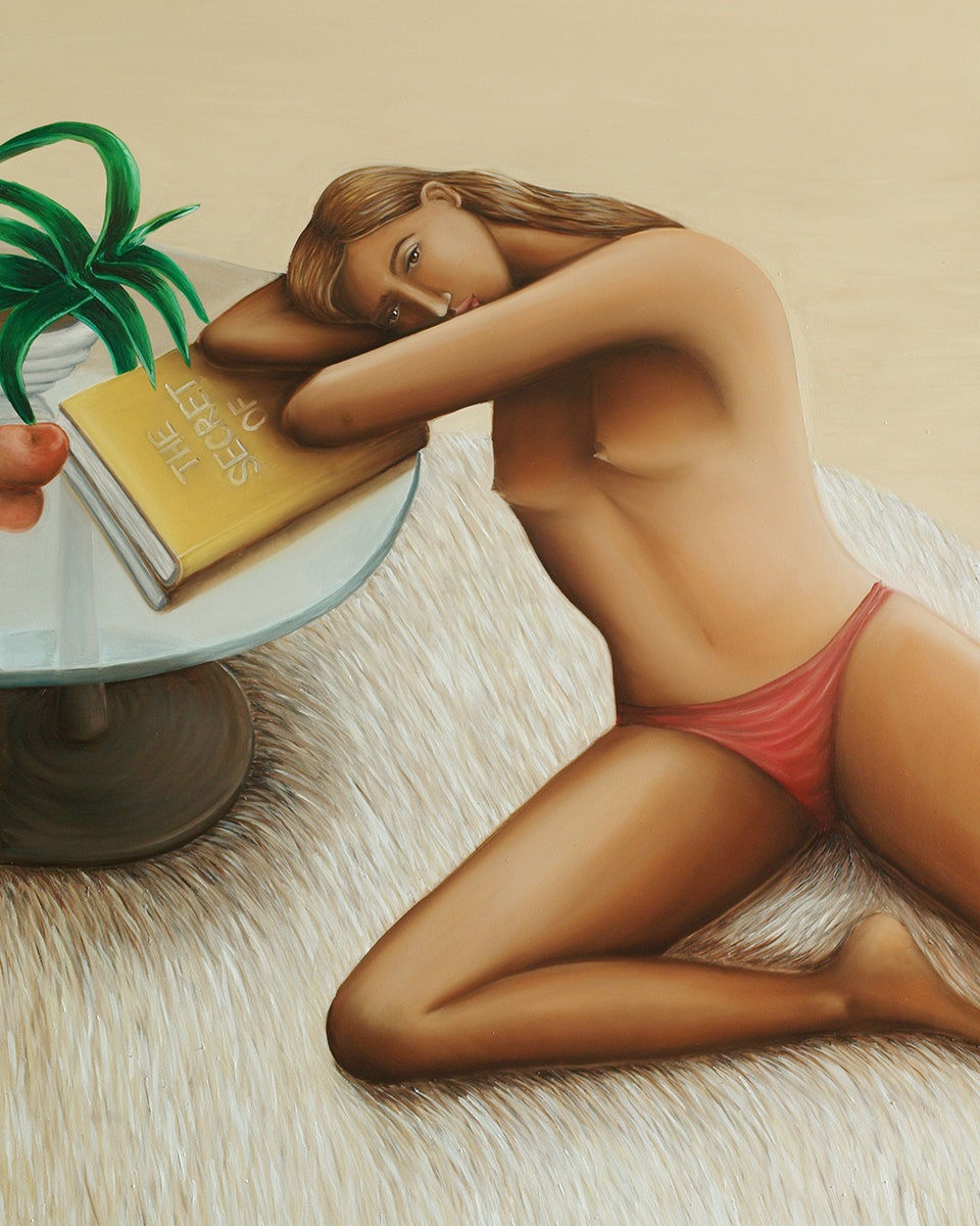 Jule Waibel painting of a topless woman sitting on the floor, resting her head on a side table with an open book