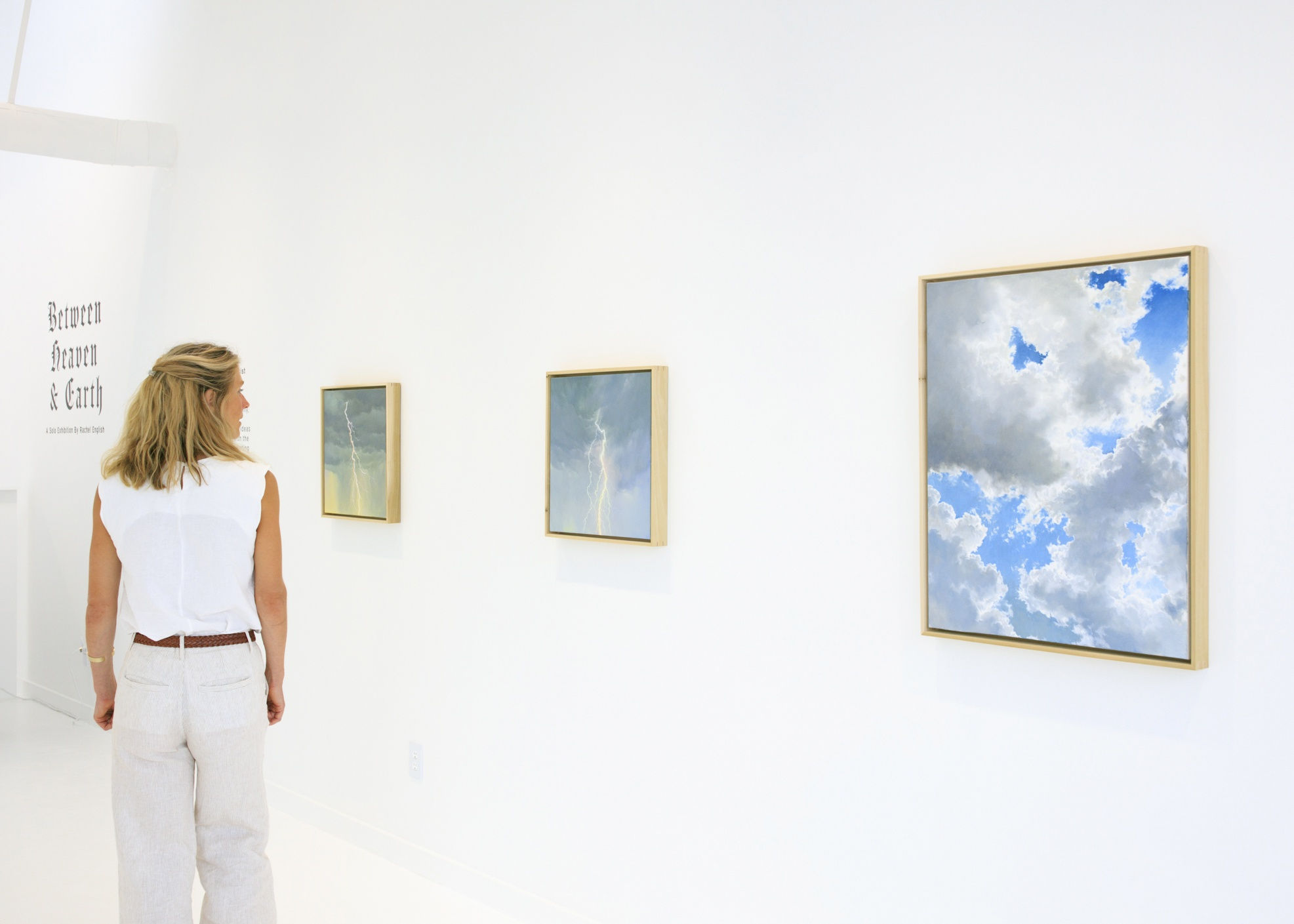 Rachel English and Cloud paintings installation view at Square One Gallery for Between Heaven & Earth exhibition
