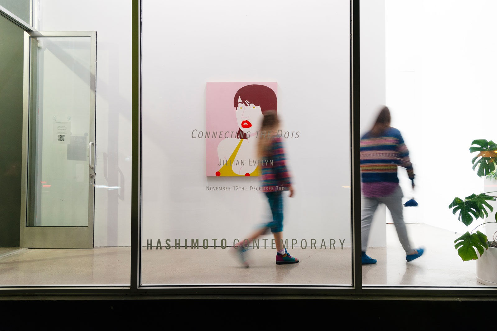 Photo of front window with title name vinyl and painting