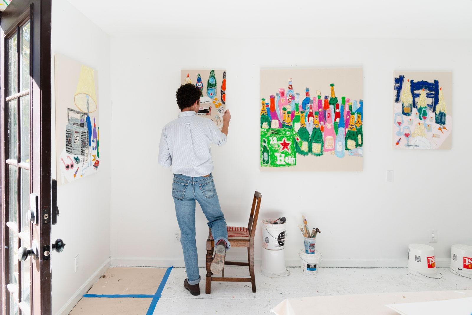 Michael McGregor painting in his studio
