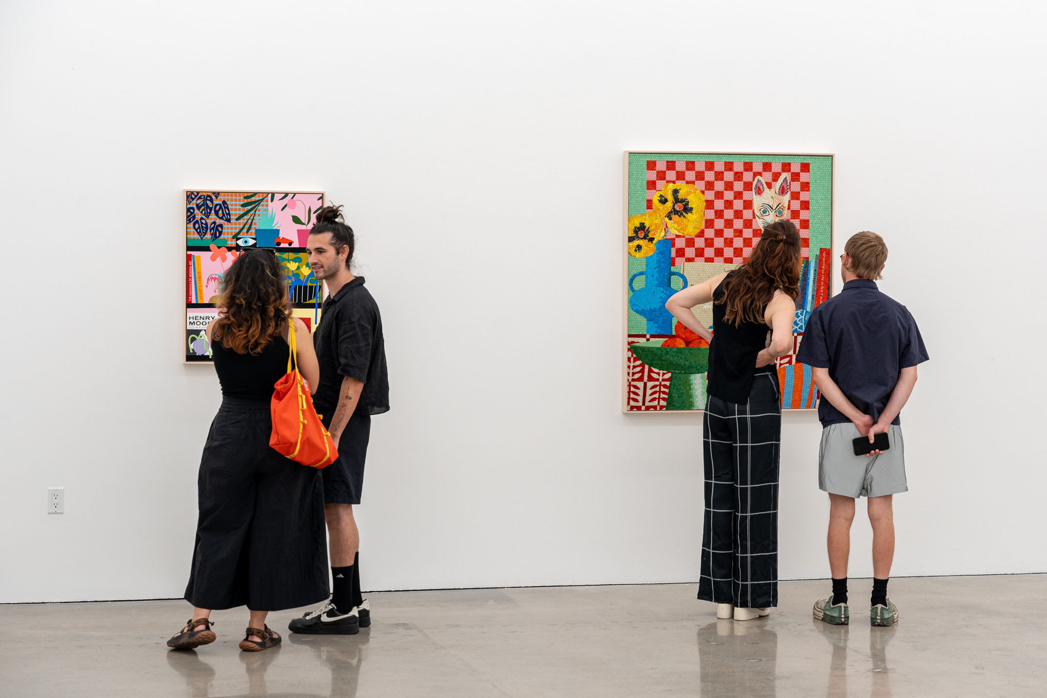 photo of people looking at Mary Finlayson's artwork at the opening reception of her exhibition