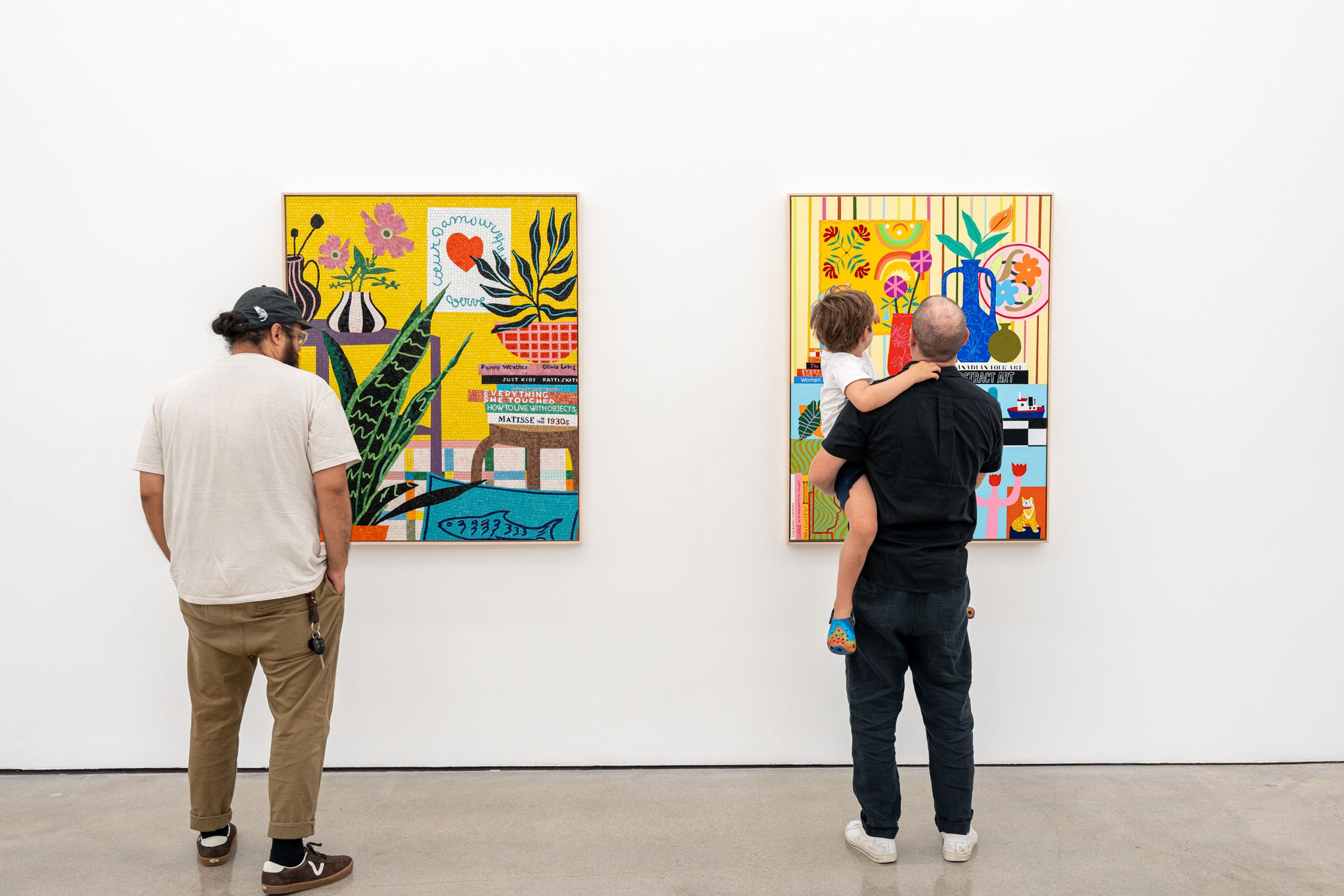 photo of people looking at Mary Finlayson's artwork at the opening reception